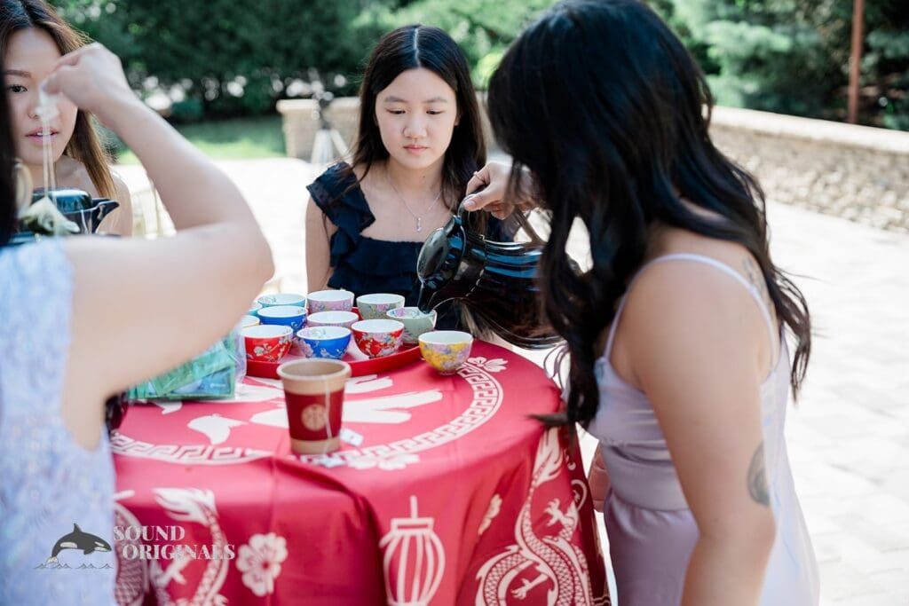 Wedding guests serving tea at The Abbington Distinctive Banquets Wedding