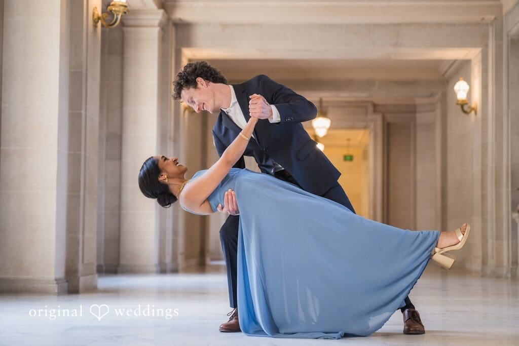 Engagement photo at San Francisco City Hall, one of the 24 Best Places for Engagement Photos in San Francisco, captured by our San Francisco wedding photography & videography team.