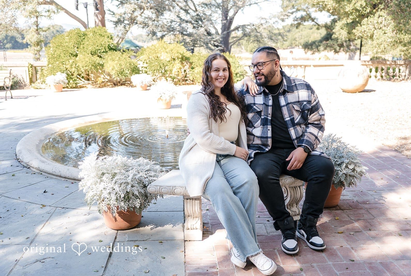 Engagement Photography session by Original Weddings capturing close-up of couple with bride smiling at Filoli Gardens.