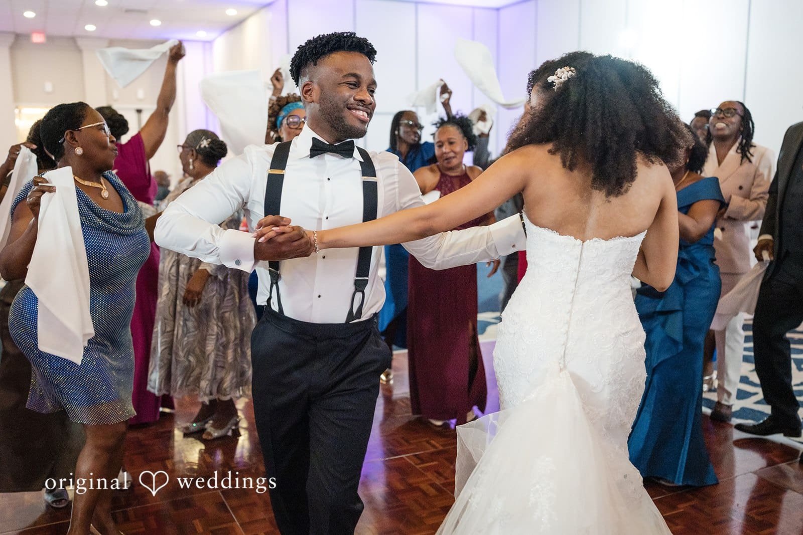 Ramon + Alexandra Newlyweds dance together joyfully at wedding reception