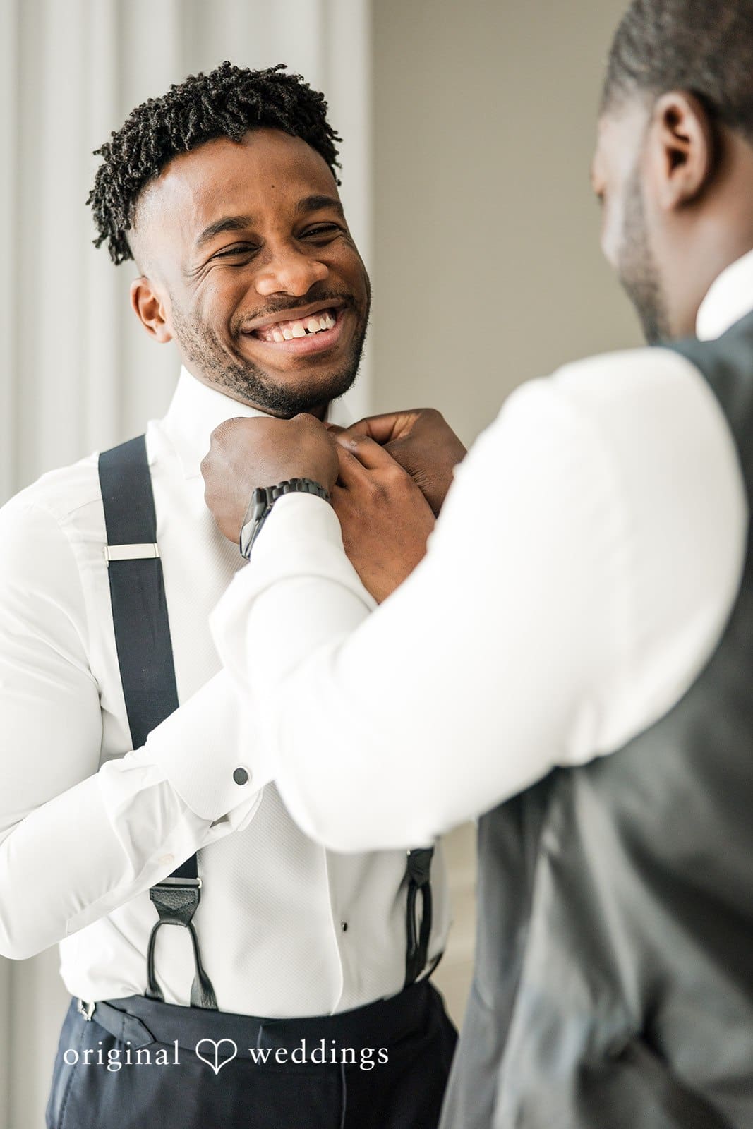 Ramon + Alexandra Groom getting ready adjusting his suit