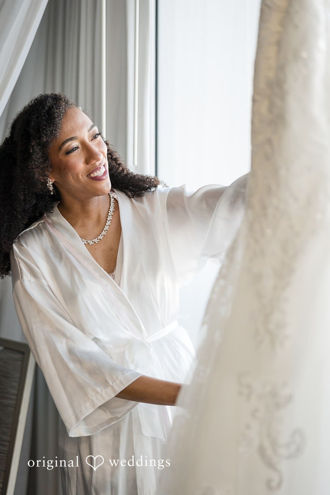 Ramon + Alexandra Bride admiring her wedding dress before ceremony
