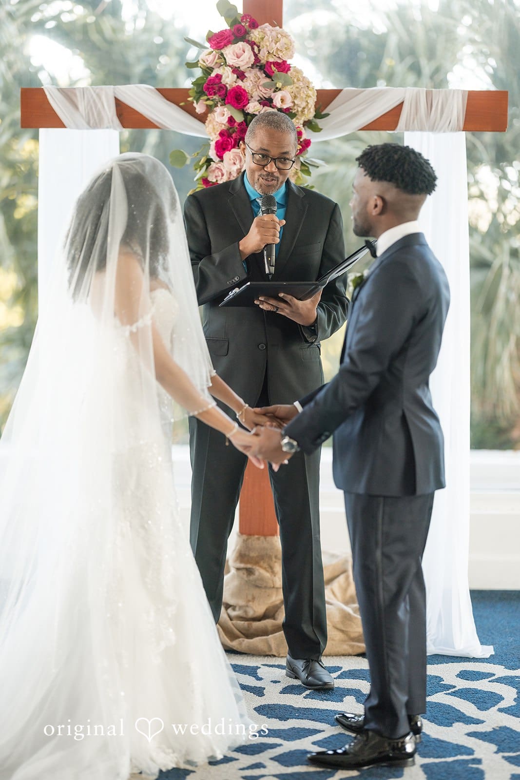 Ramon + Alexandra Wedding couple holding hands captured by Miami wedding photographer from original weddings at Bahia Mar Fort Lauderdale
