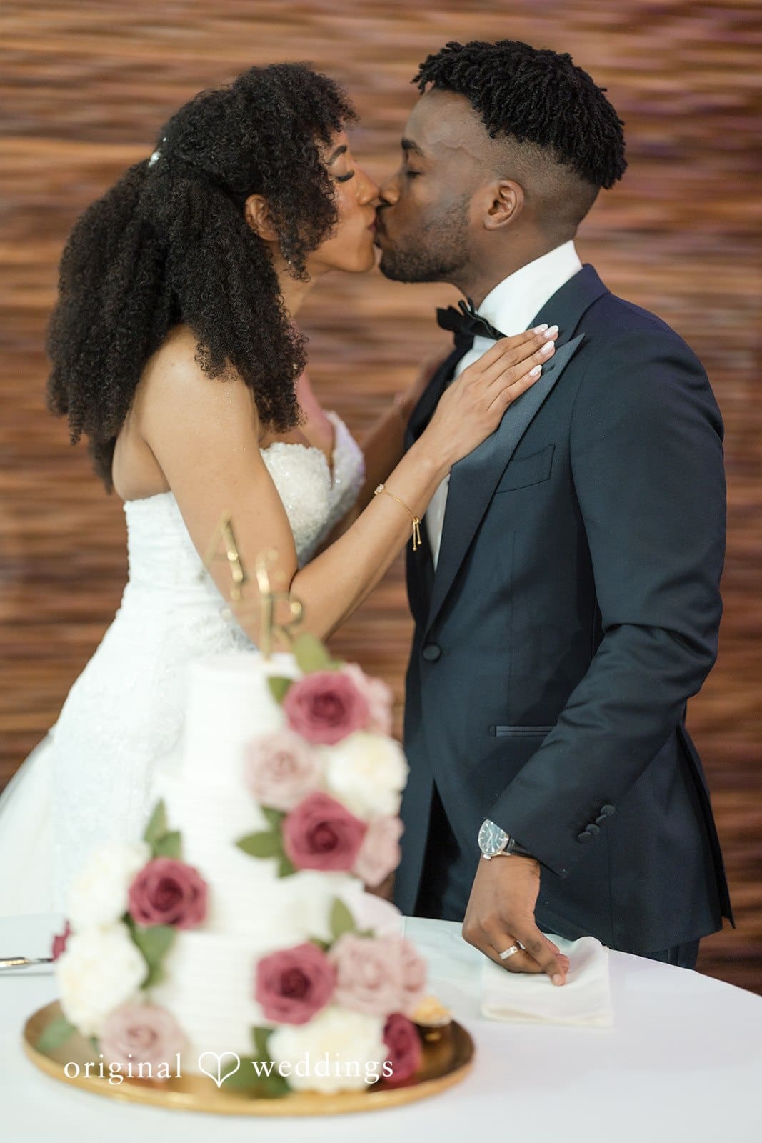 Ramon + Alexandra Couple kisses sweetly before cutting their wedding cake together