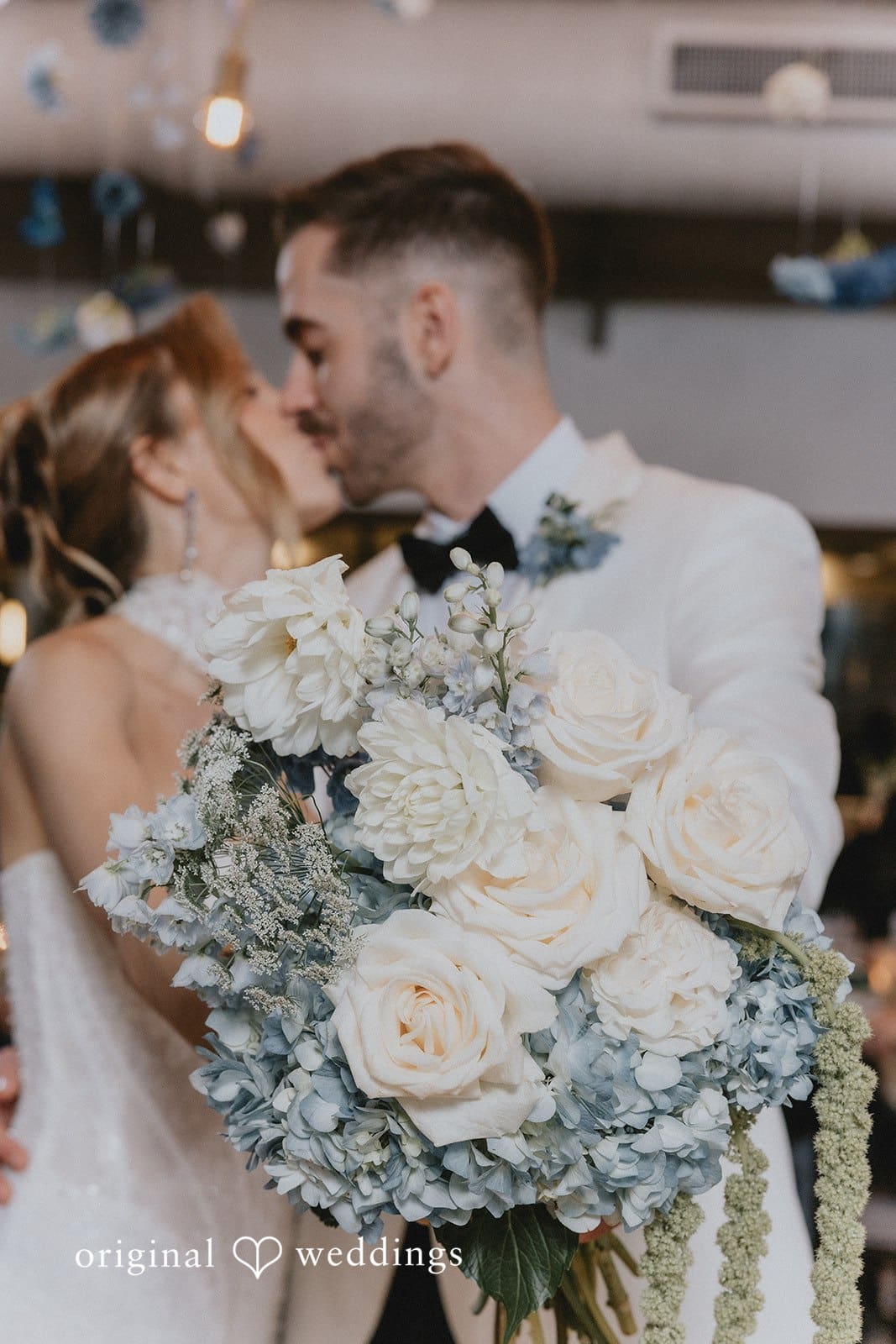 Sabrina + Ryan Bride and groom sharing a joyful kiss.