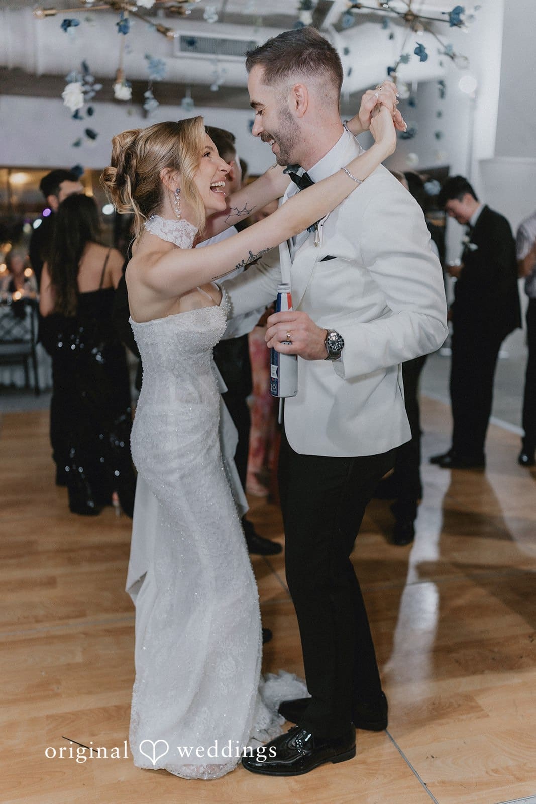 Sabrina + Ryan Bride and groom celebrating on dance floor.