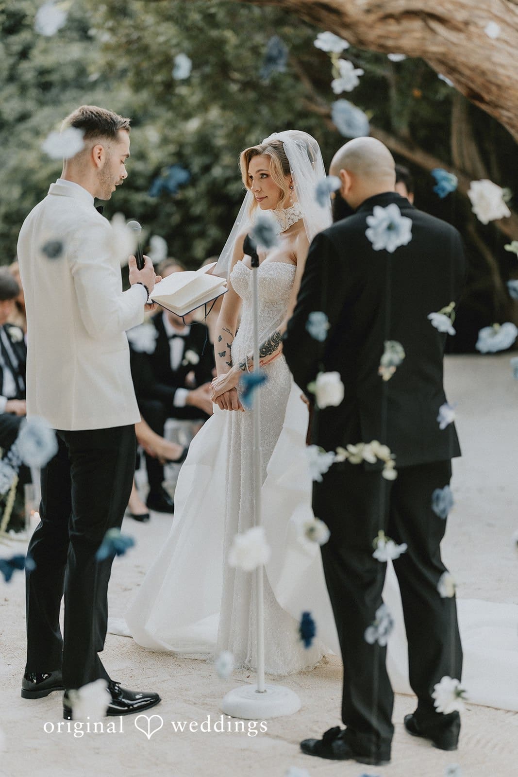 Sabrina + Ryan Ceremony moment with officiant and couple.