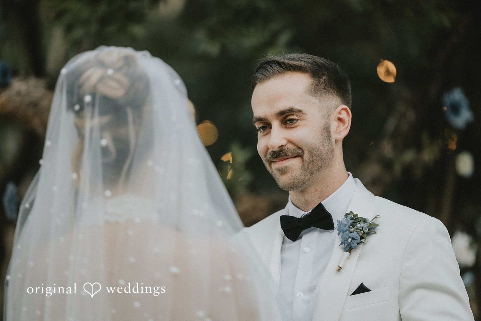 Sabrina + Ryan Groom see bride with happy face.