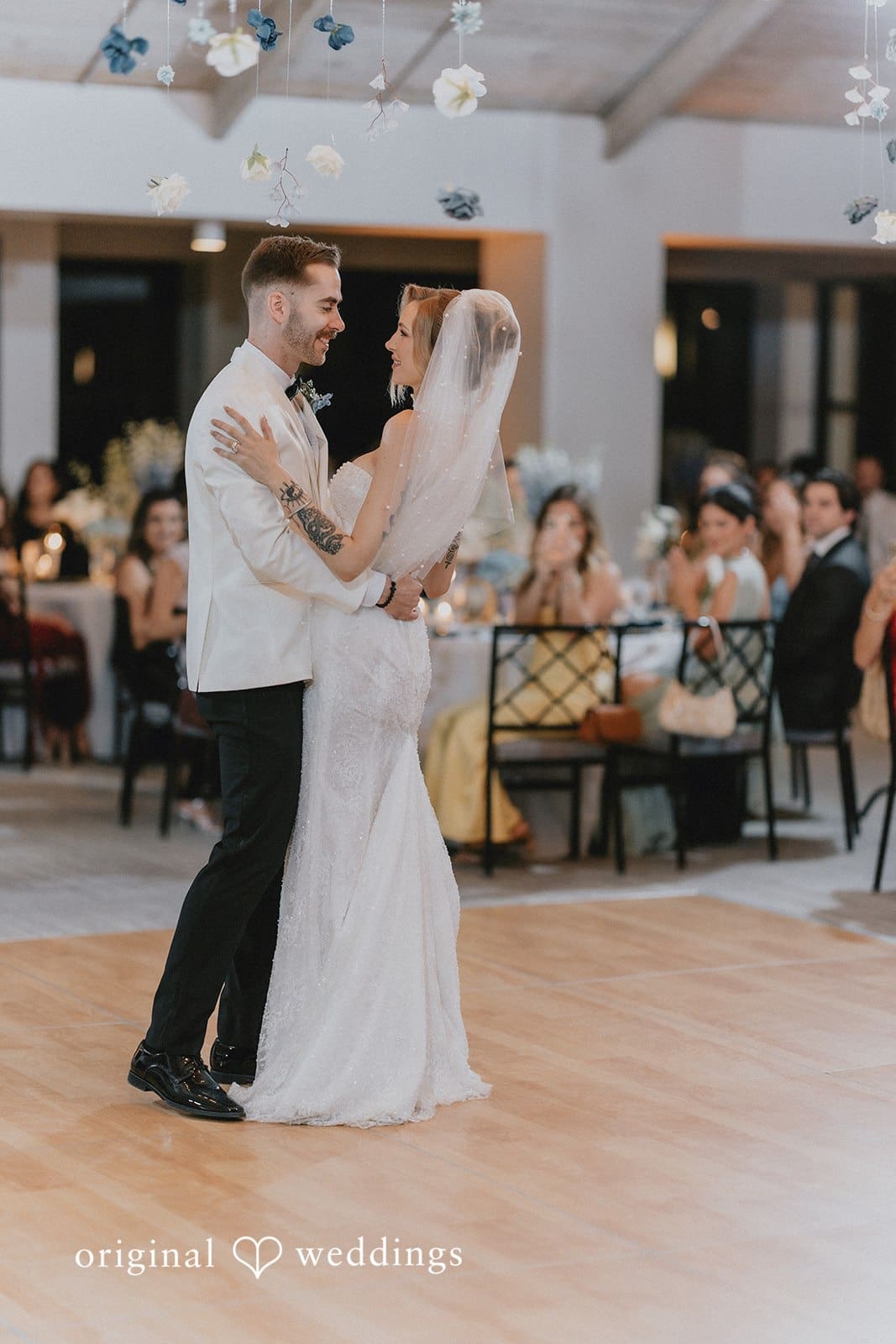 Sabrina + Ryan Couple sharing their first dance at wedding reception.