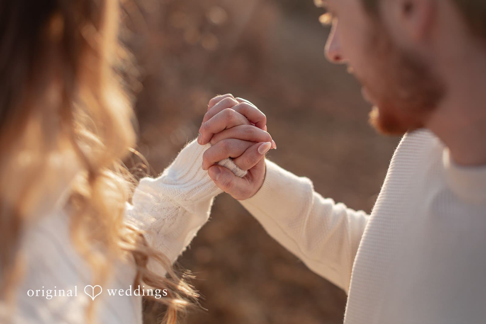 Rosemary + James A close-up shot of the couple holding hands