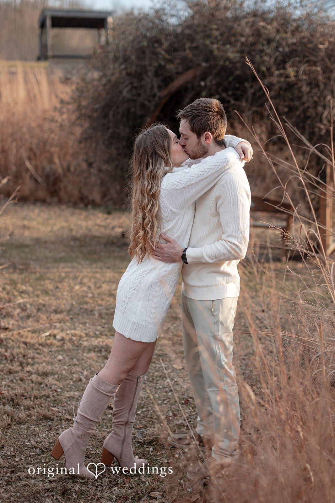 Rosemary + James The couple shares a romantic kiss at the park