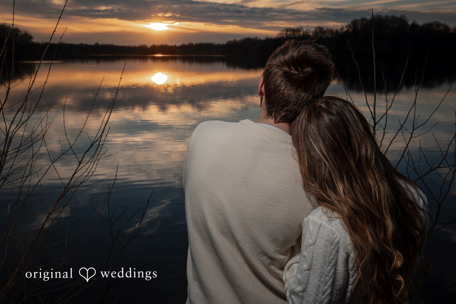 Rosemary + James A back view portrait of the couple overlooking the water