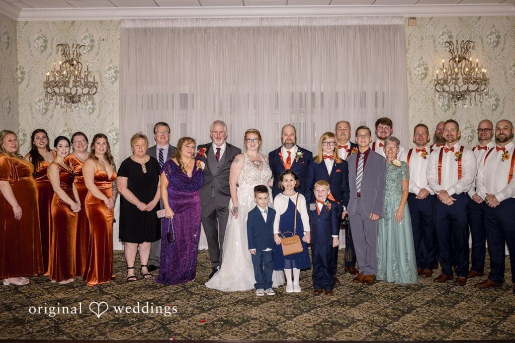 Our Philadelphia wedding photographer at Original Weddings captures a portrait of the bride and groom with family and friends at the Buck Hotel