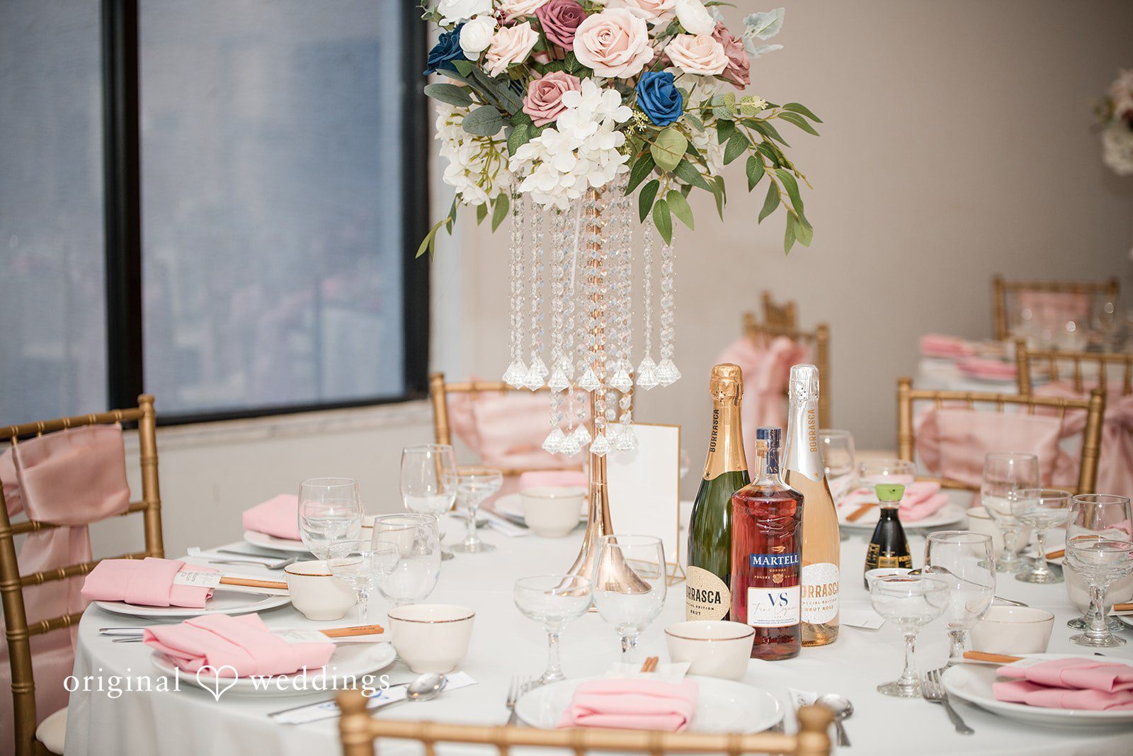 Andrea Edna + Canh Reception table with elegant tableware and centerpiece.
