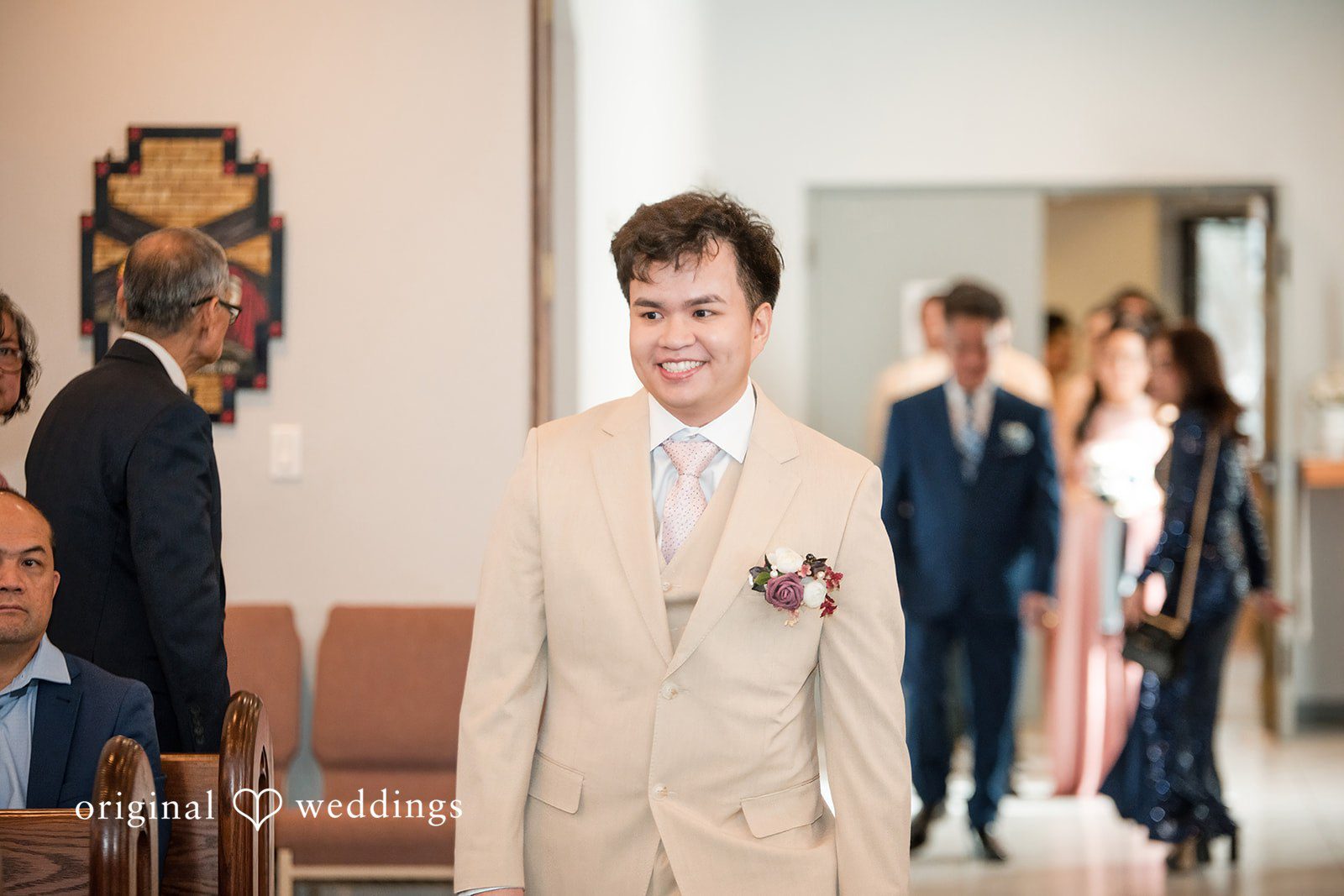 Andrea Edna + Canh Groom walking down the aisle.