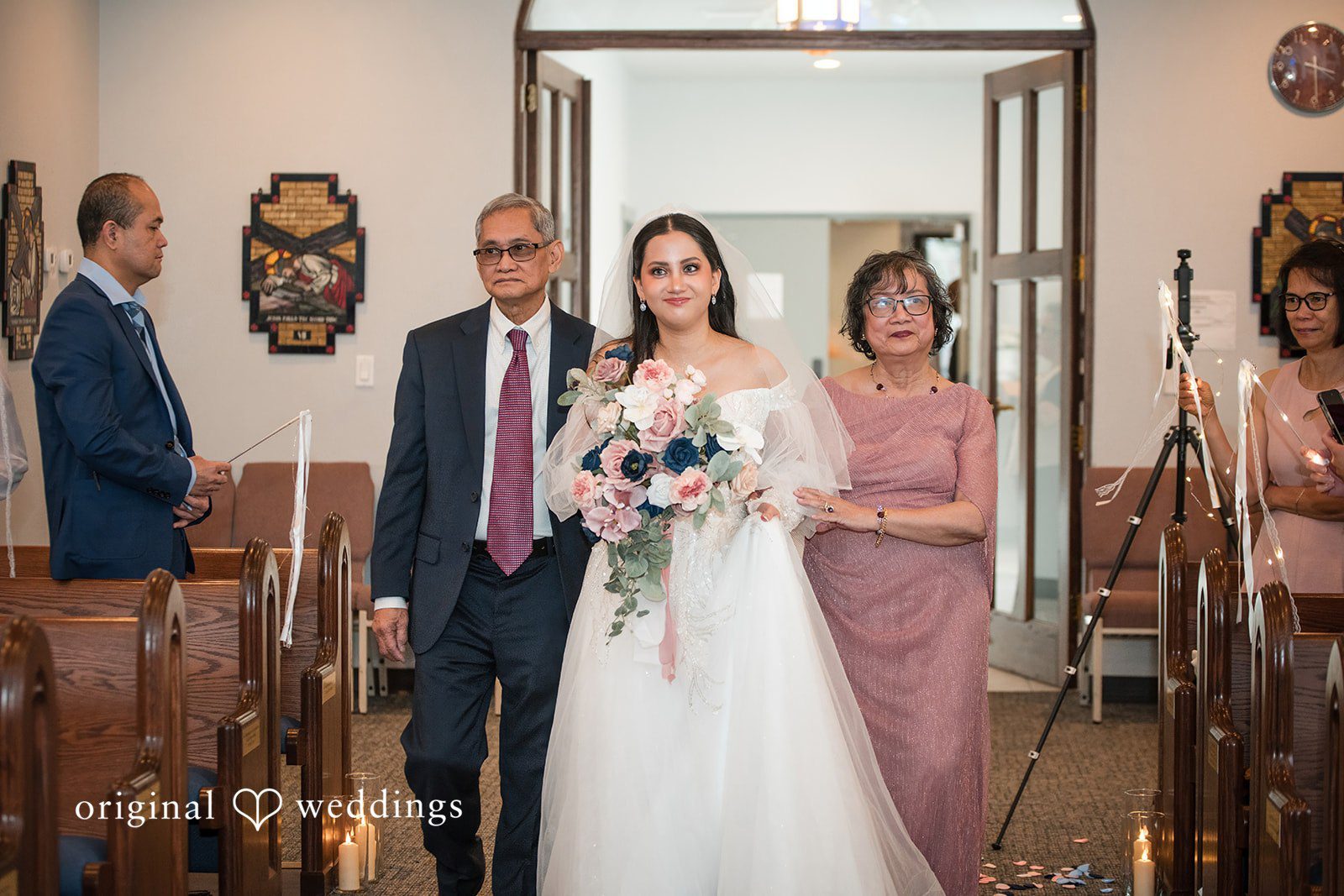 Andrea Edna + Canh Bride walking down the aisle with parents.