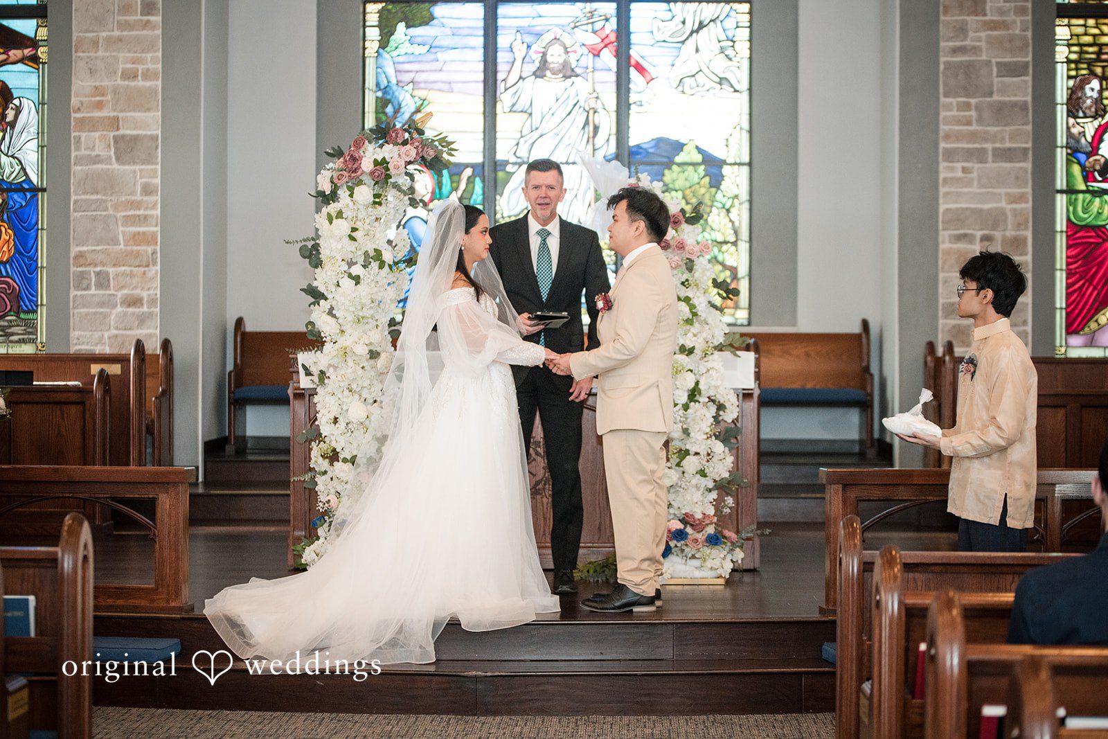 Andrea Edna + Canh Couple standing together during wedding ceremony at Canterbury Hall Tampa