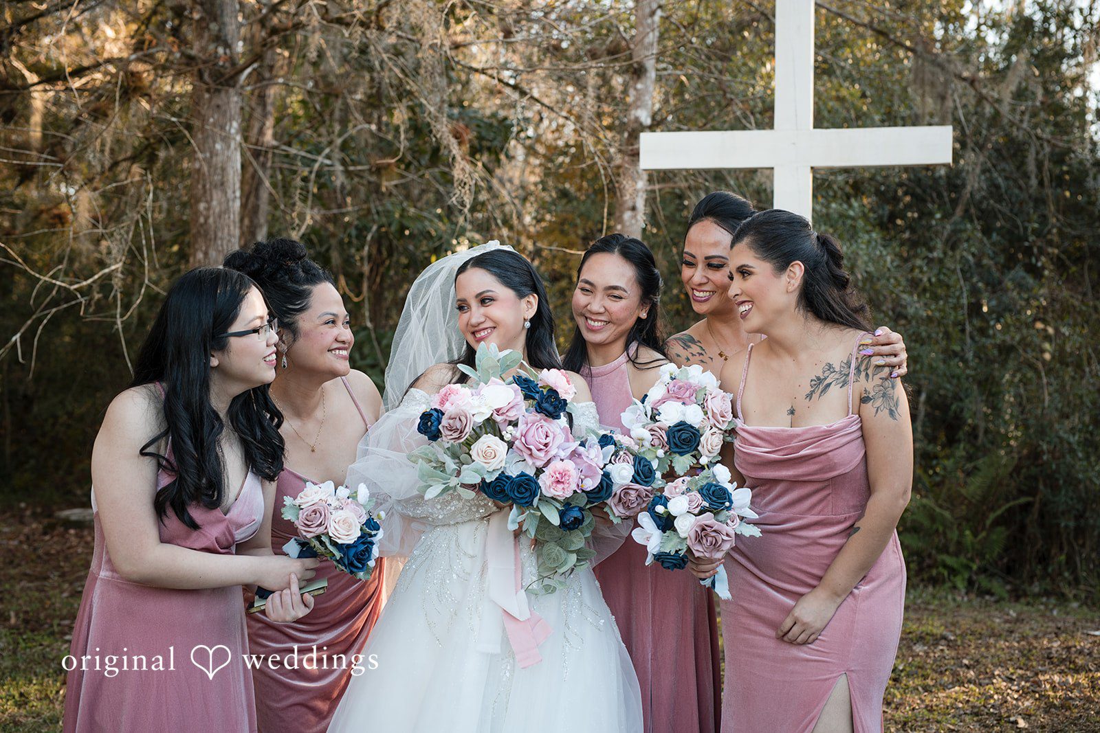 Andrea Edna + Canh Bridesmaids holding bouquets and smiling.