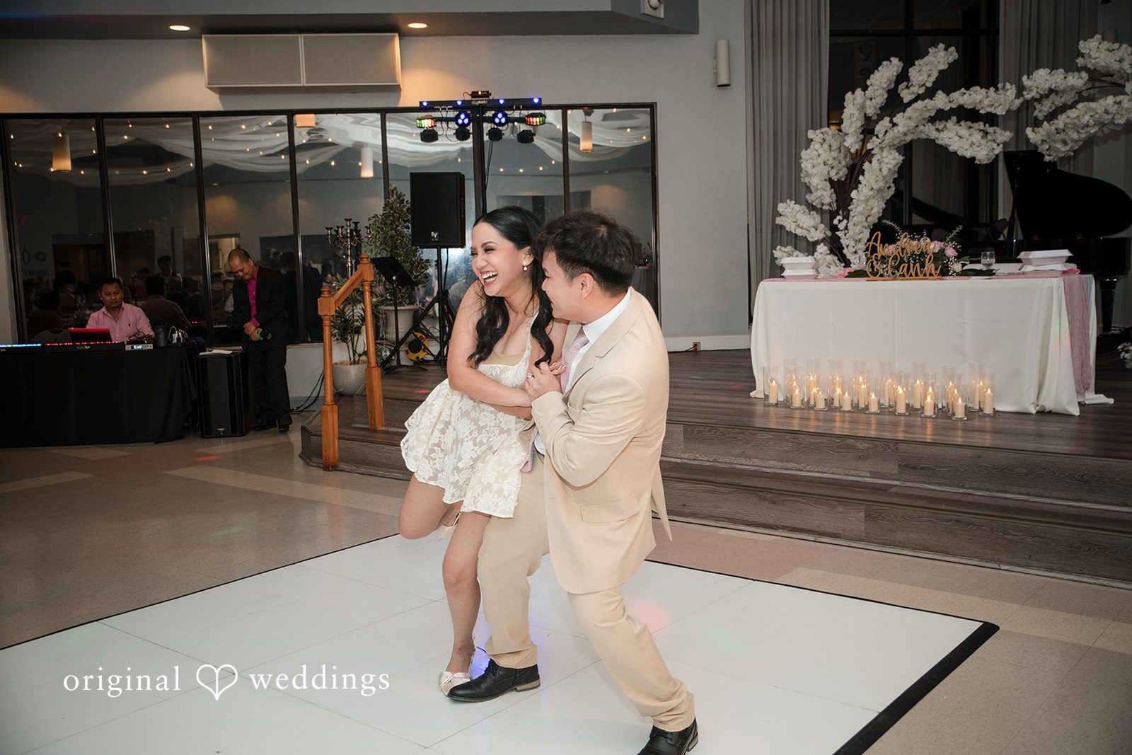 Andrea Edna + Canh Bride dancing with groom in a wedding venue.