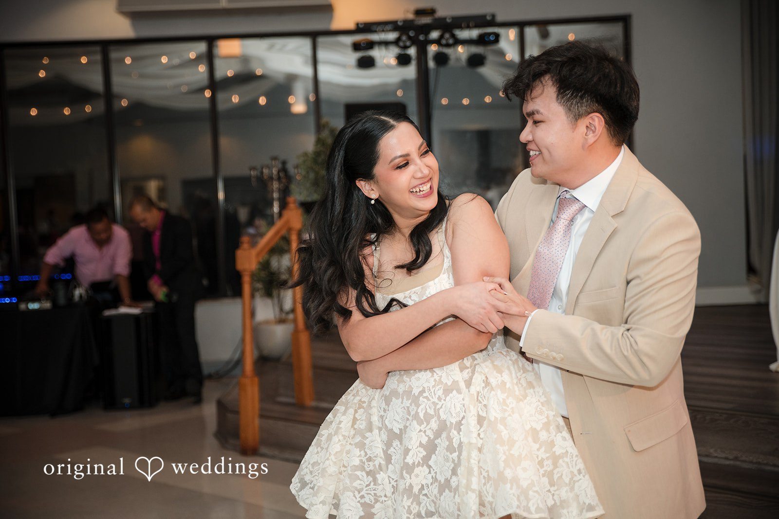 Andrea Edna + Canh Couple dancing closely during reception.