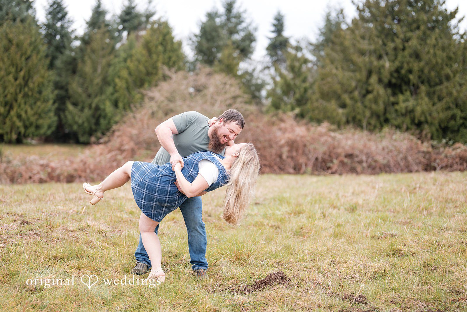 Kayla + Dillon Close-up of bride and groom in a loving hold while smiling at each other at Clark Lake Park