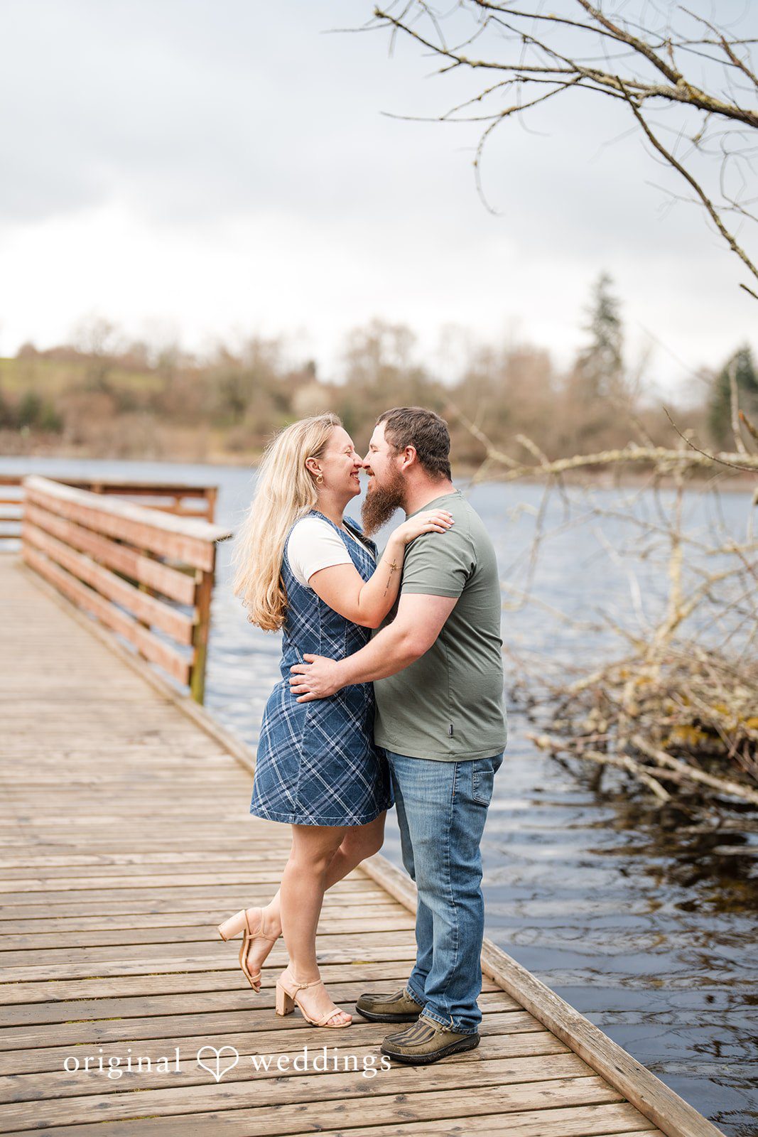 Kayla + Dillon Loving couple standing closely together at Clark Lake Park