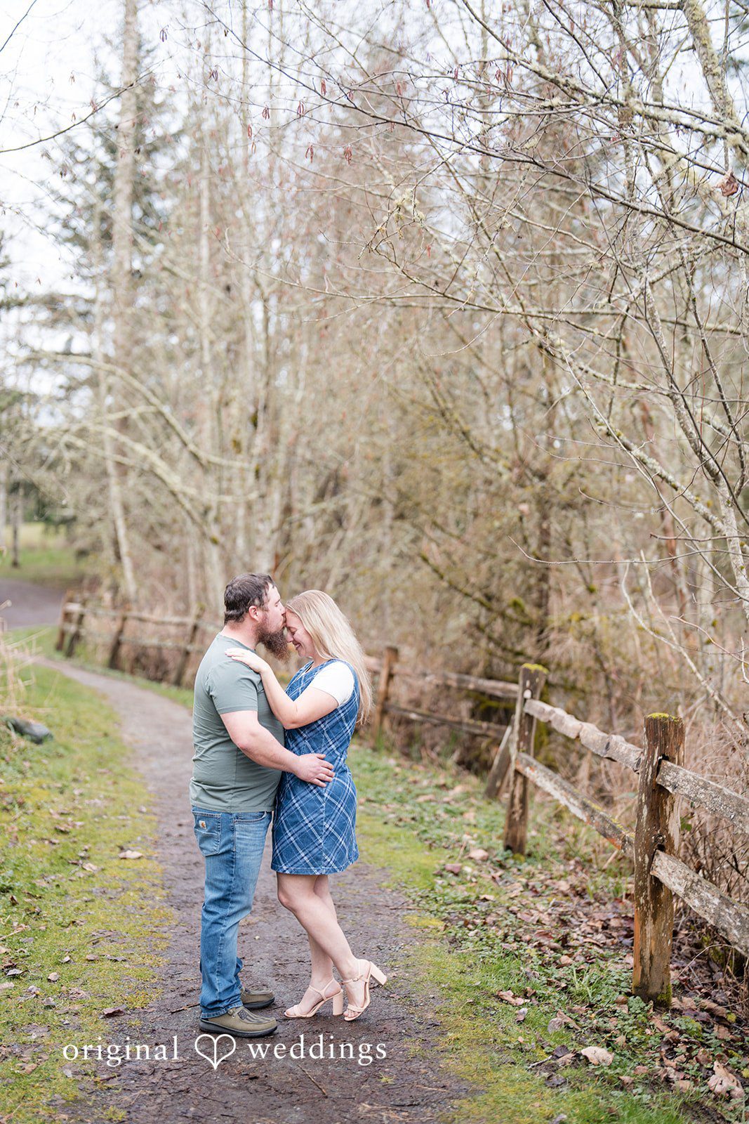 Kayla + Dillon Close-up of groom kissing bride’s forehead at Clark Lake Park