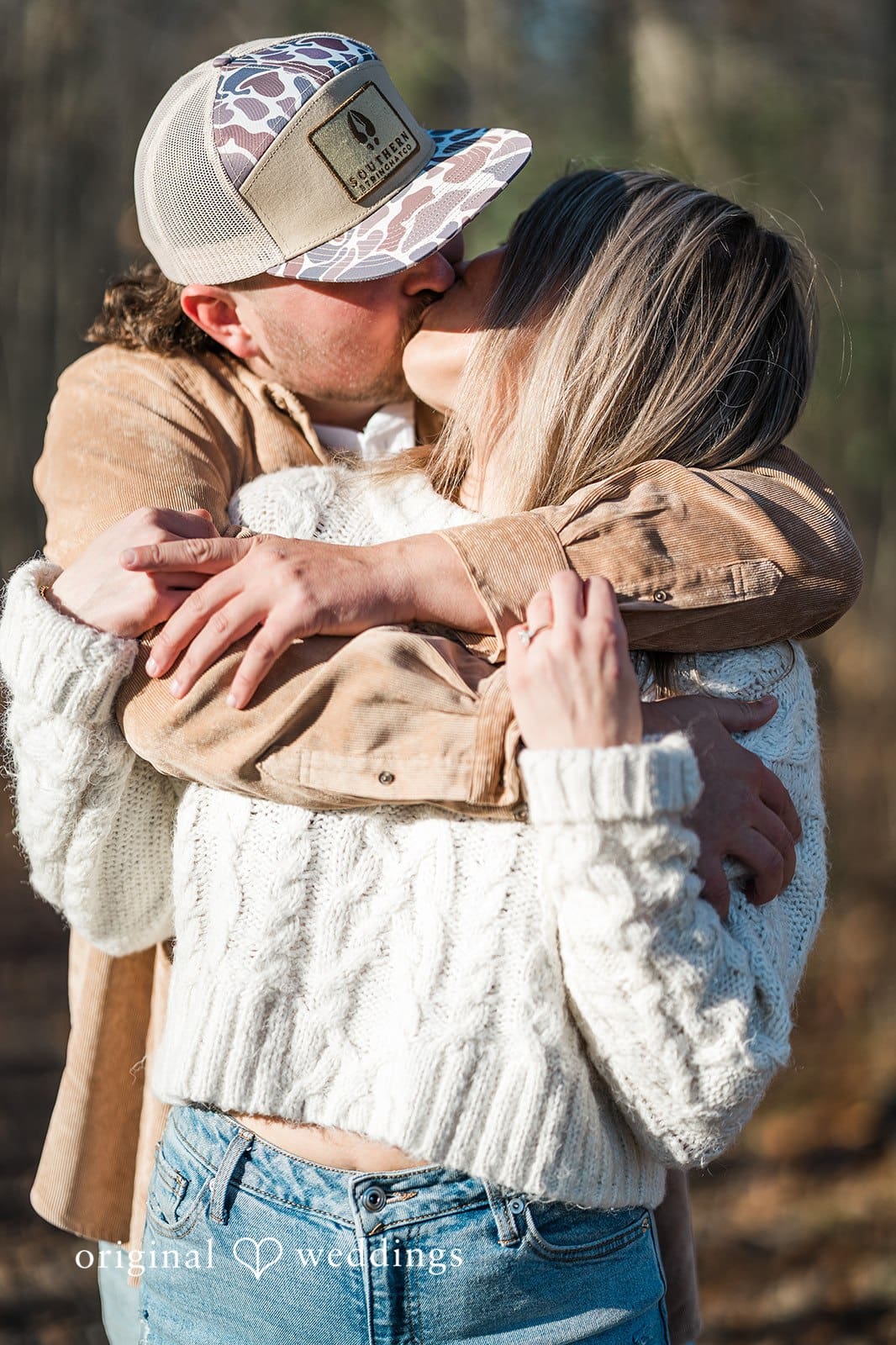 The couple shares a kiss