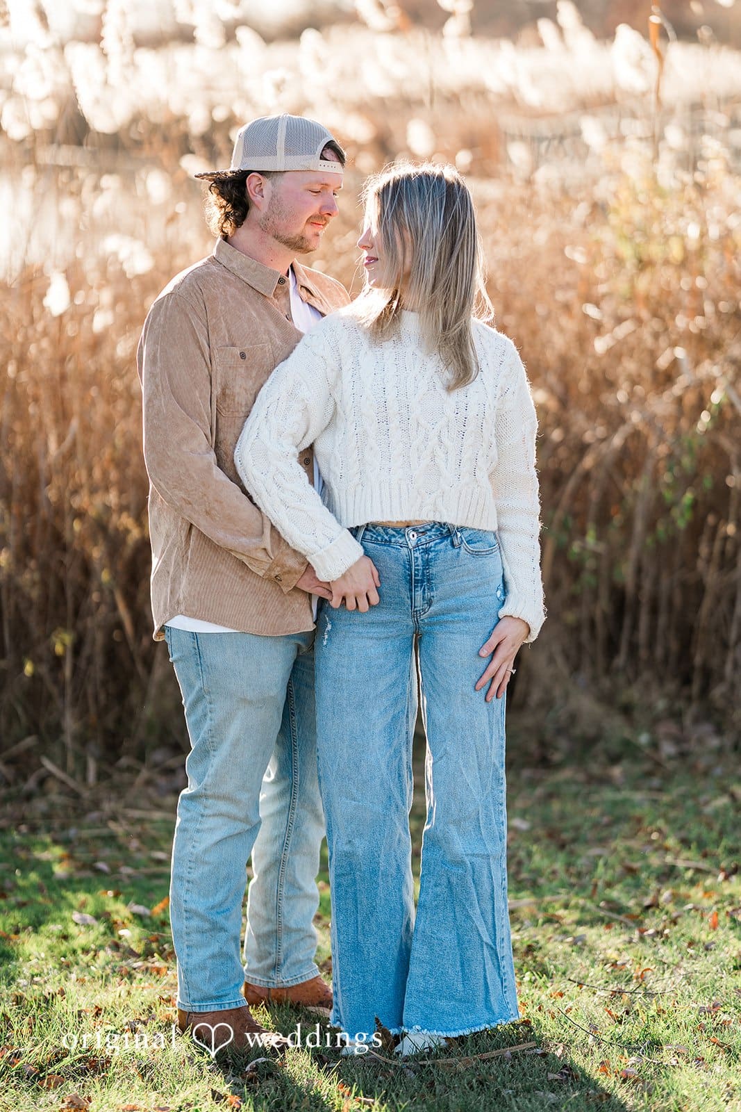 A romantic portrait of the couple in the wide fields at Crosswind Marshes