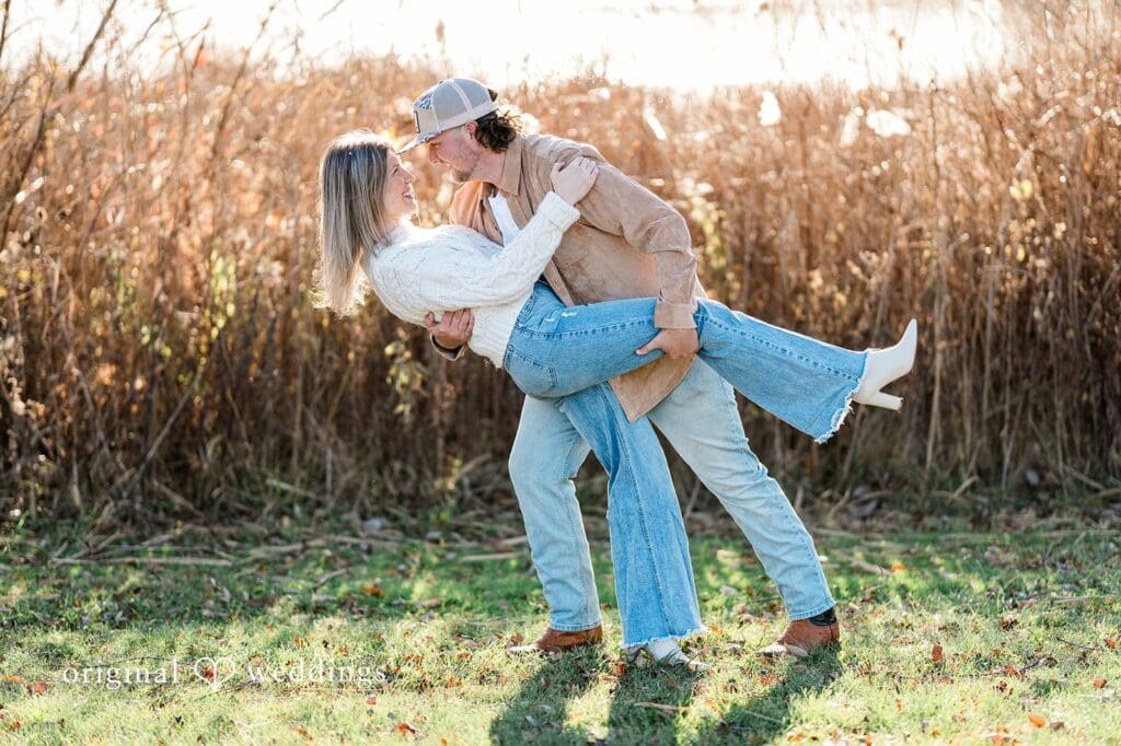 Our Detroit wedding photographer at Original Weddings took a romantic portrait of the couple in the wide field at Crosswind Marshes