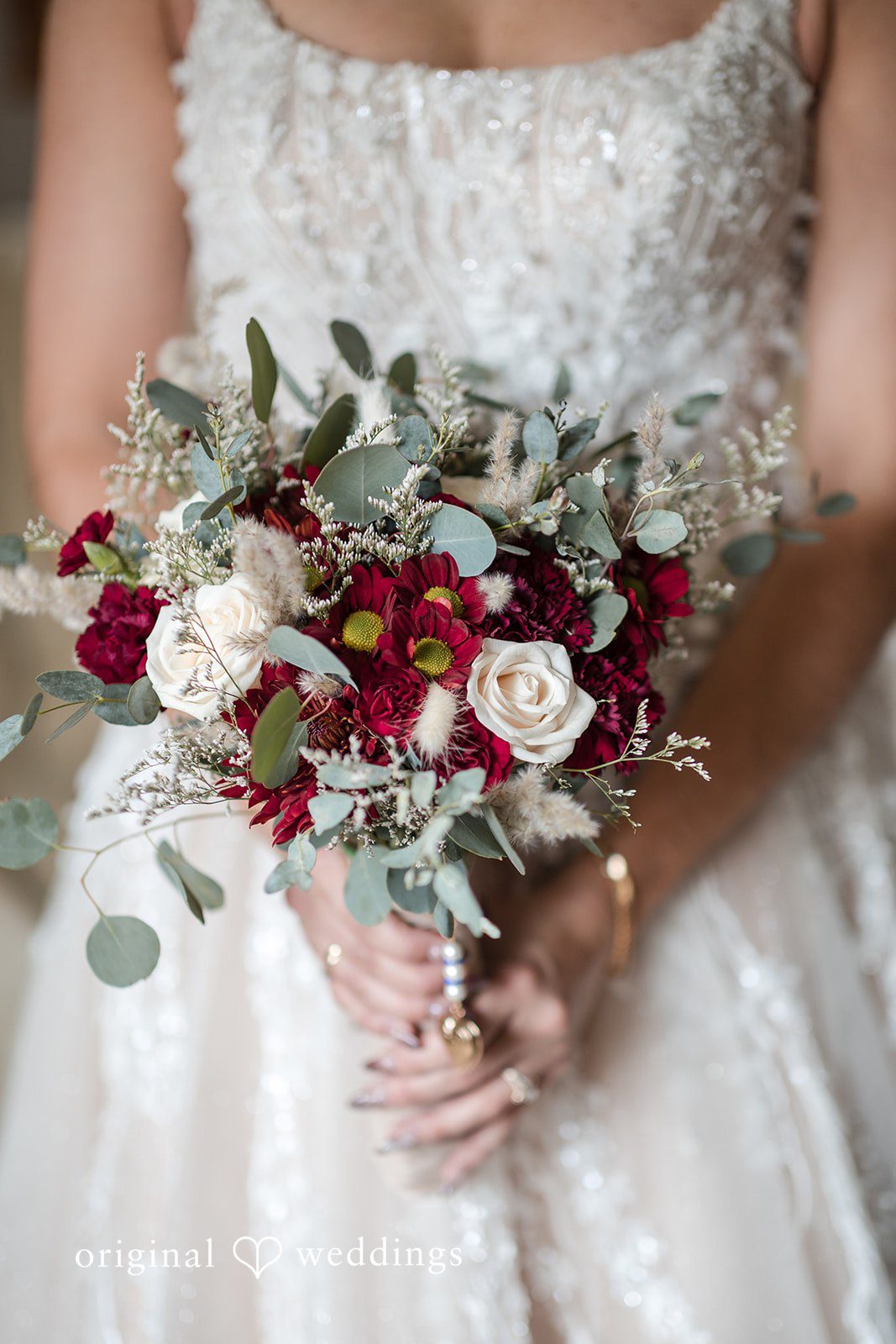 A close-up shot of the bride holding her huge bouquet