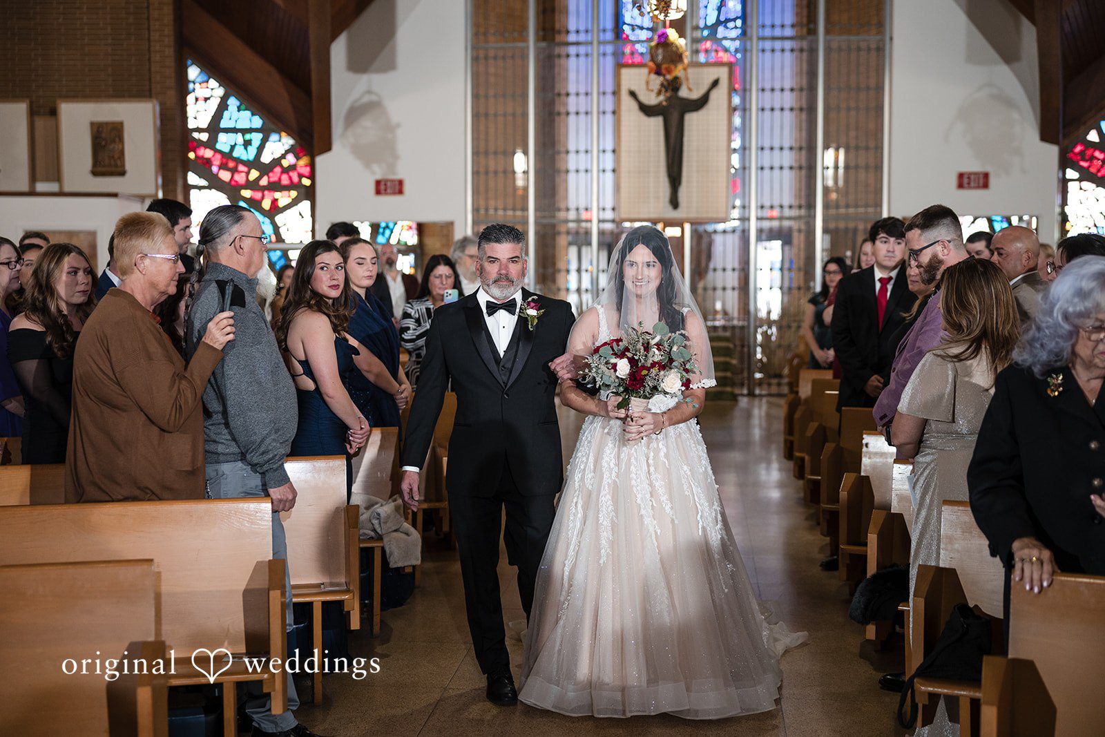 Our Philadelphia wedding photographer captured a beautiful portrait of the bride's father escorting the bride down the aisle