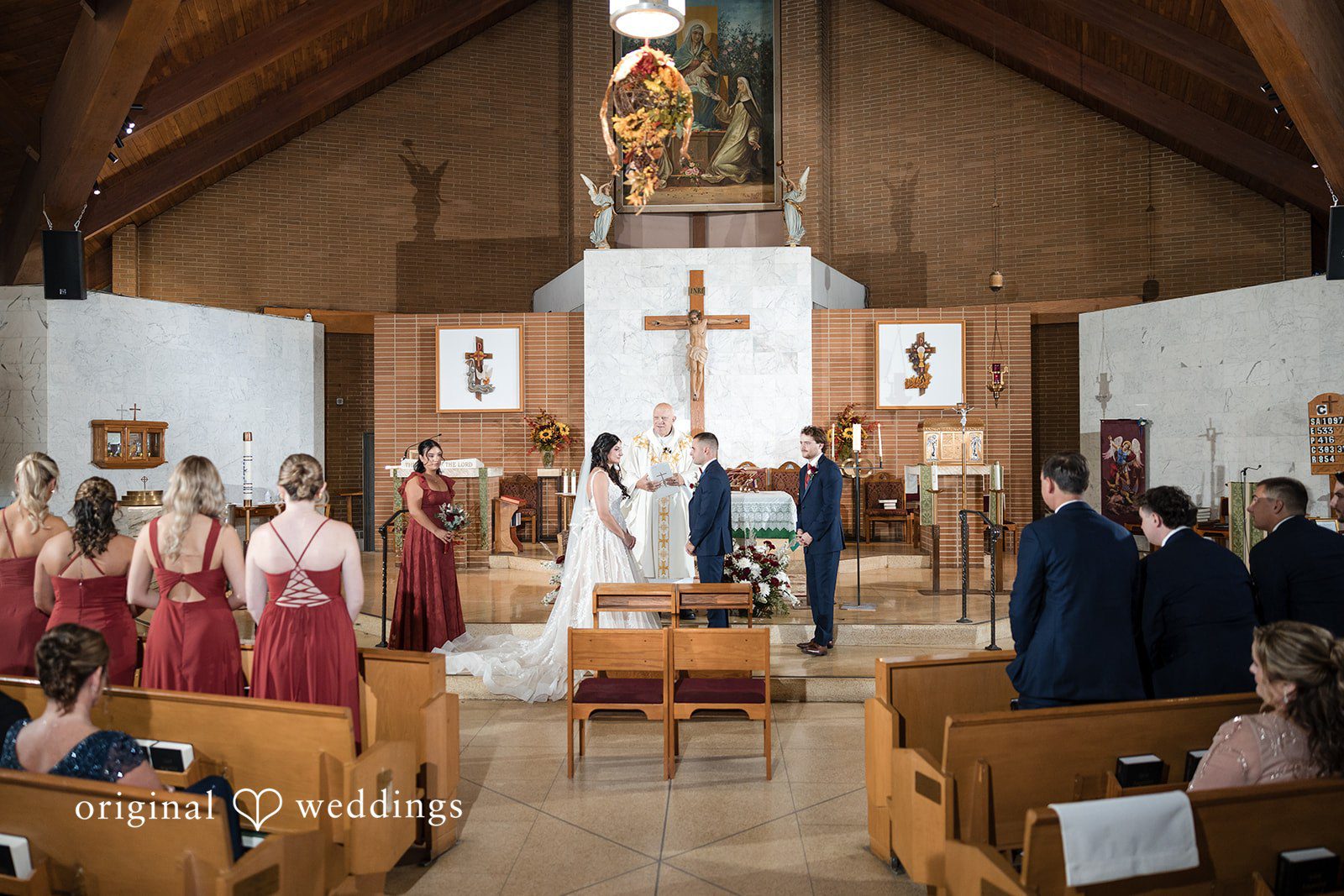 The couple at their wedding ceremony about to exchange marital vows