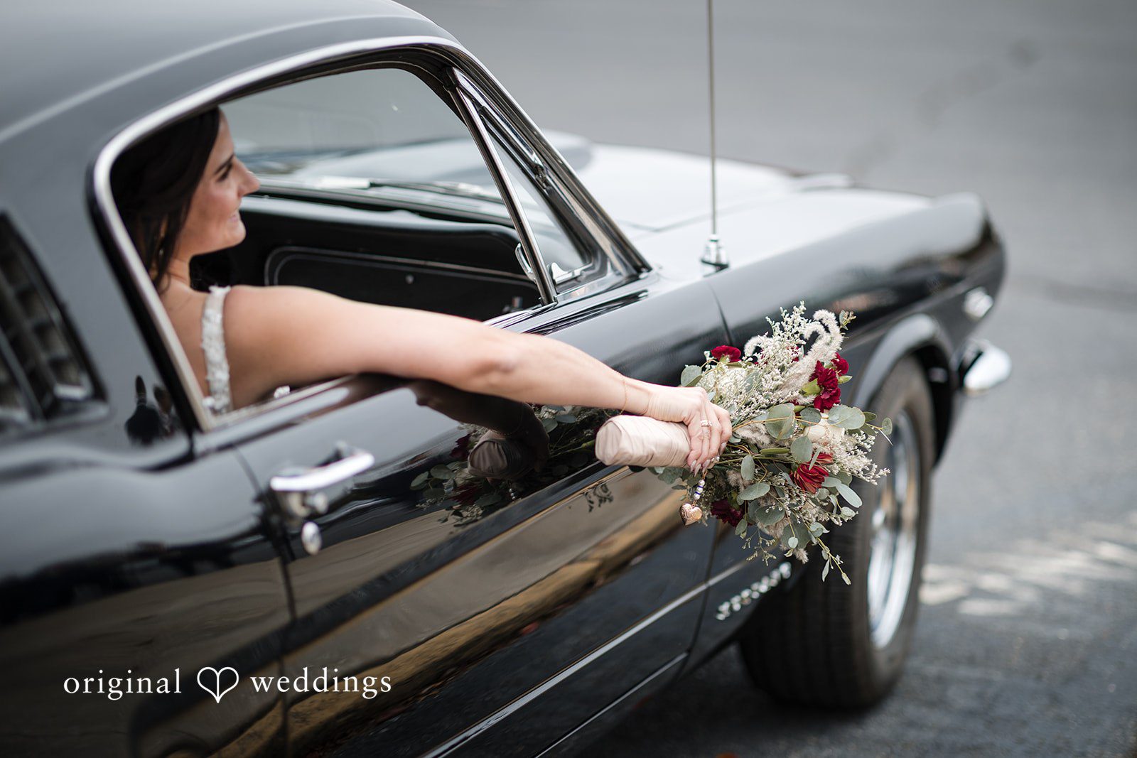 A portrait of the bride in the car