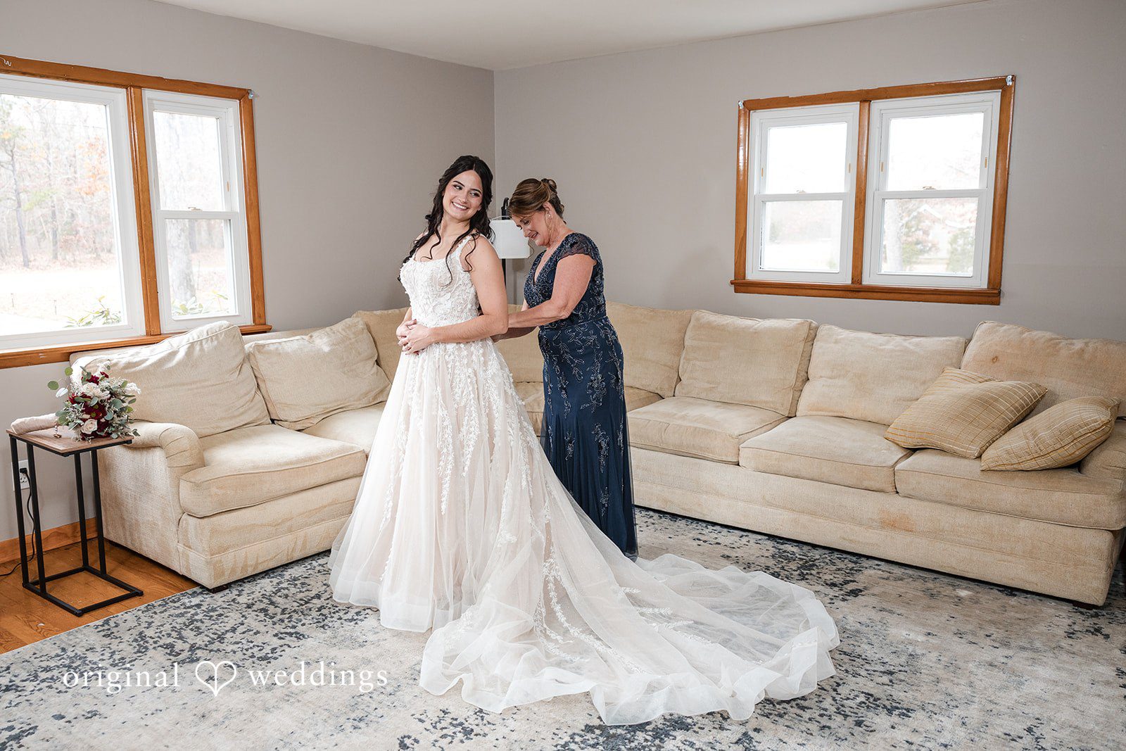 The bride's mum getting her ready at the lodge