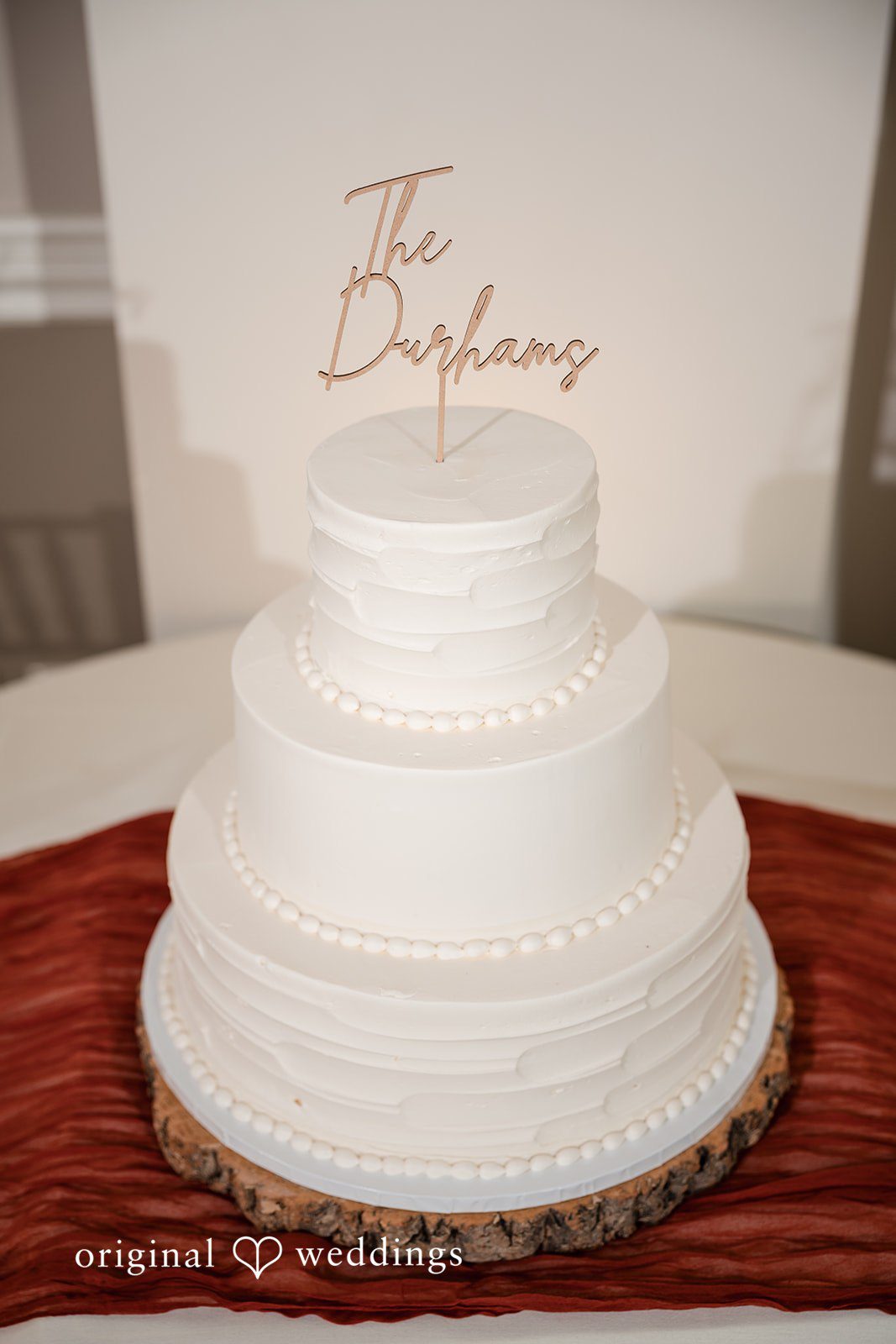 A stunning all-white wedding cake at Eastlyn Golf Course wedding reception