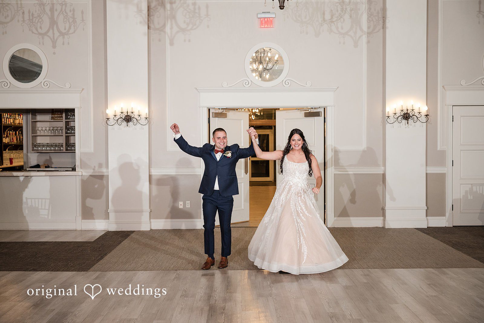 The couple's joyful entrance to their wedding reception