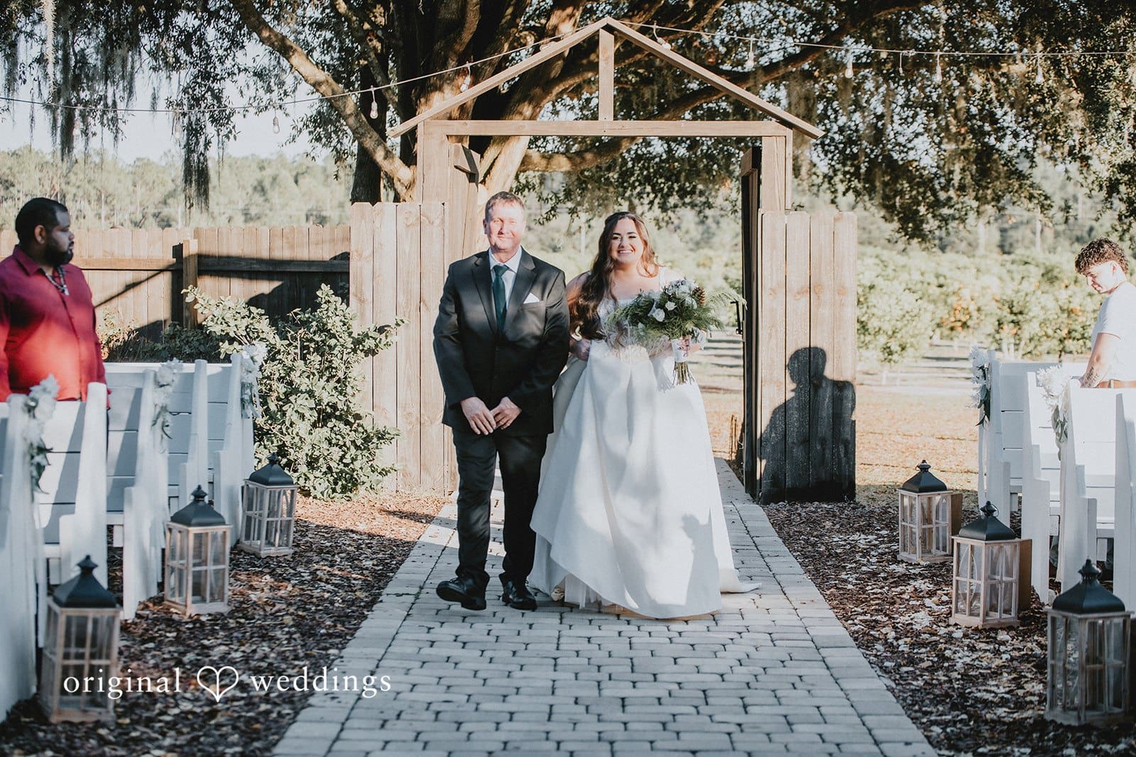 The bride's father walking bride down the aisle