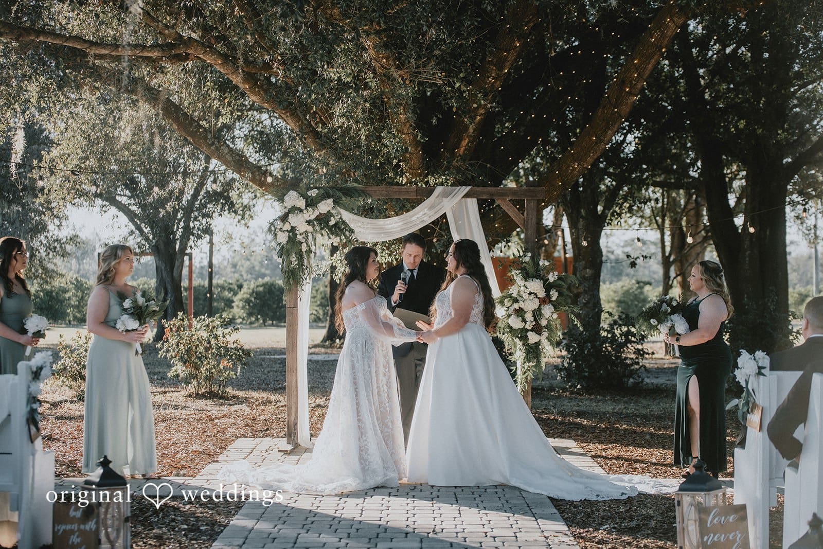 Our Orlando wedding photographers captured a portrait of the couple exchanging marital vows at Ever After Farms Citrus
