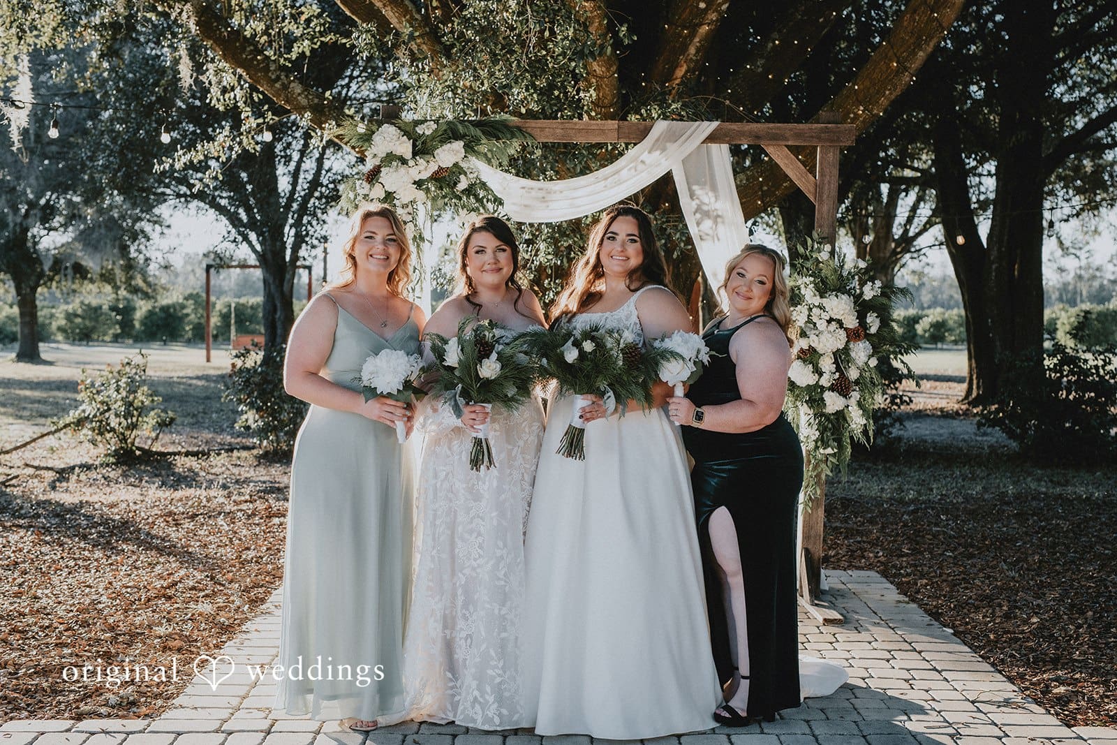 A portrait of the couple with their bridesmaids at Ever After Farms Citrus