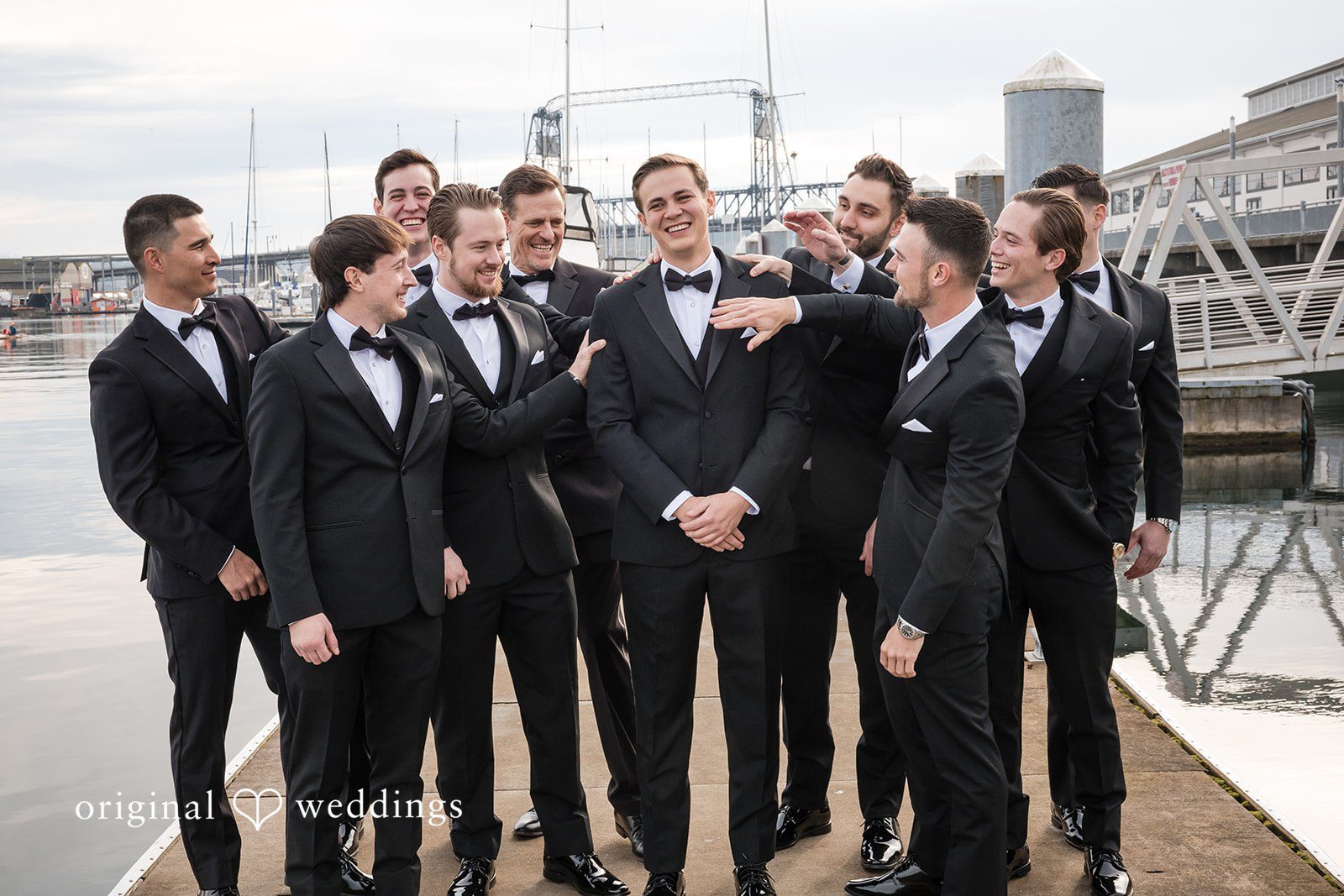 Kristi + Andrew Groomsmen posing together before ceremony