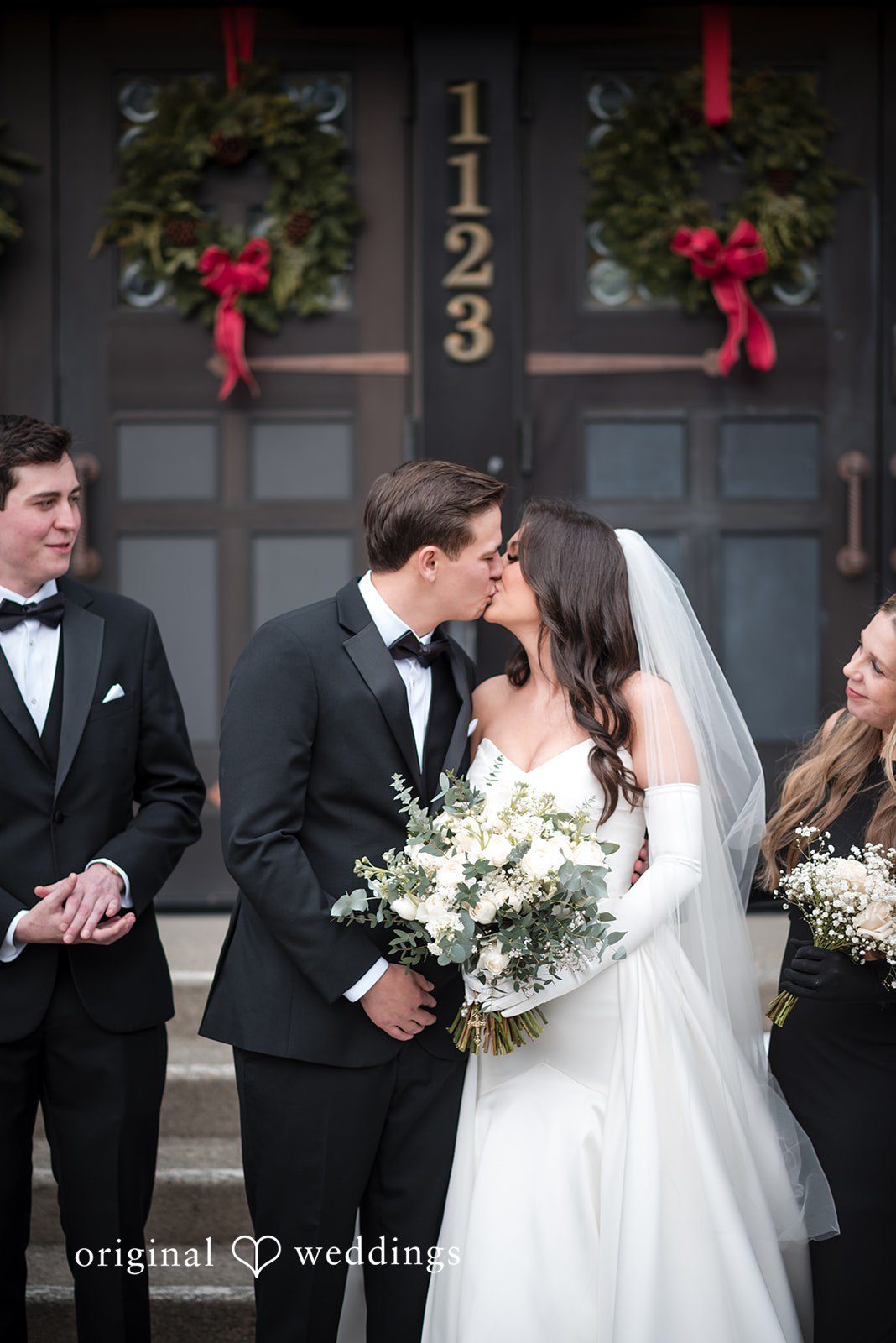 Kristi + Andrew Couple celebrating wedding day with romantic kiss