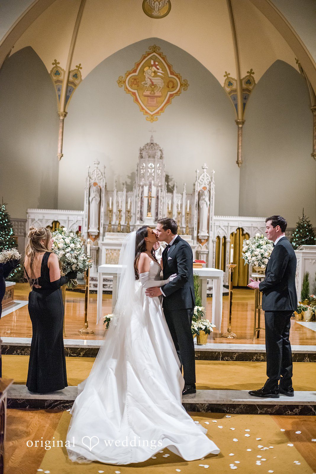 Kristi + Andrew Romantic moment of bride and groom kissing after ceremony