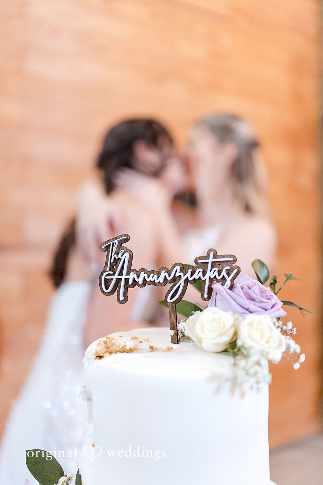 Couple cutting a wedding cake together.