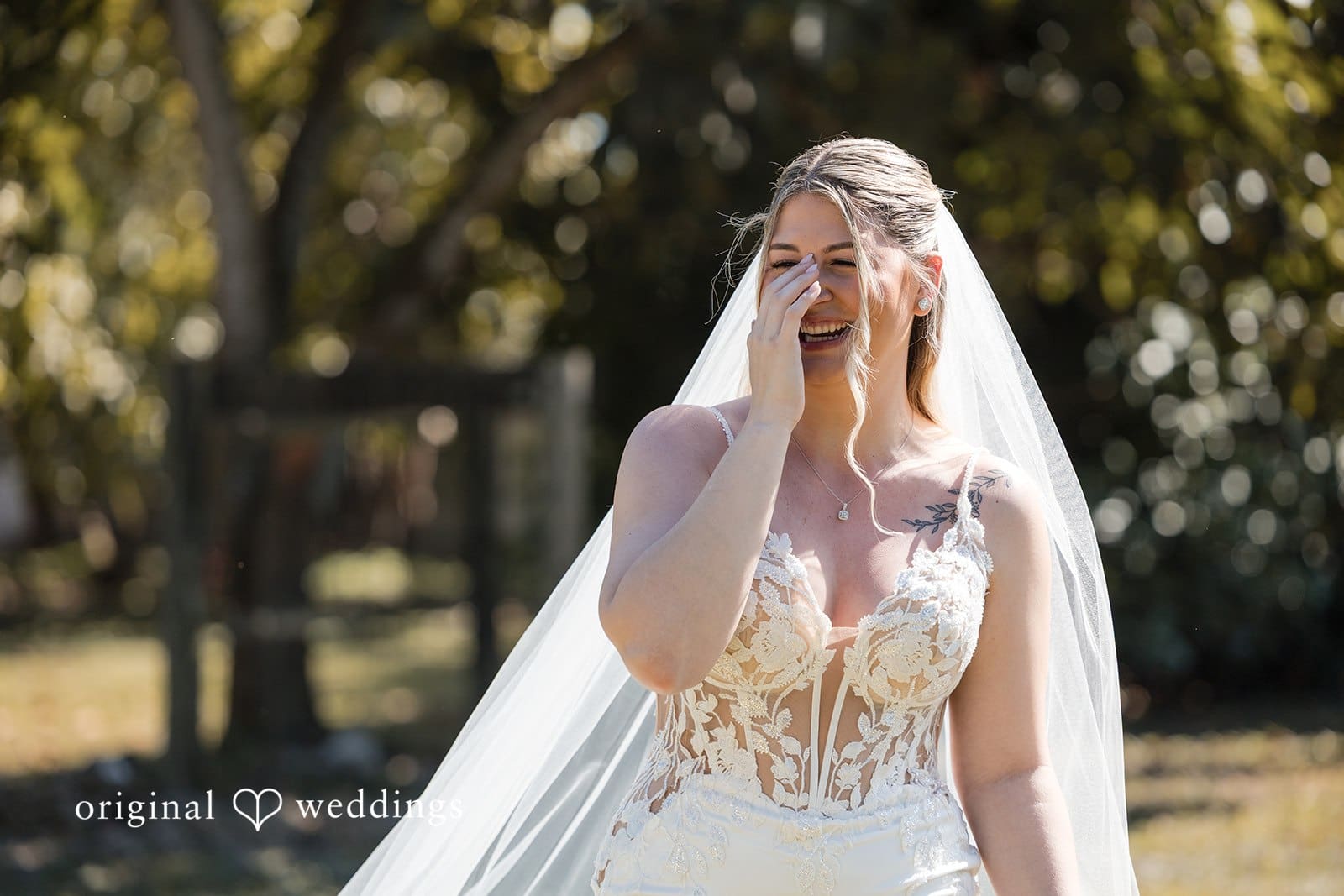Bride smiling joyfully on her wedding day.