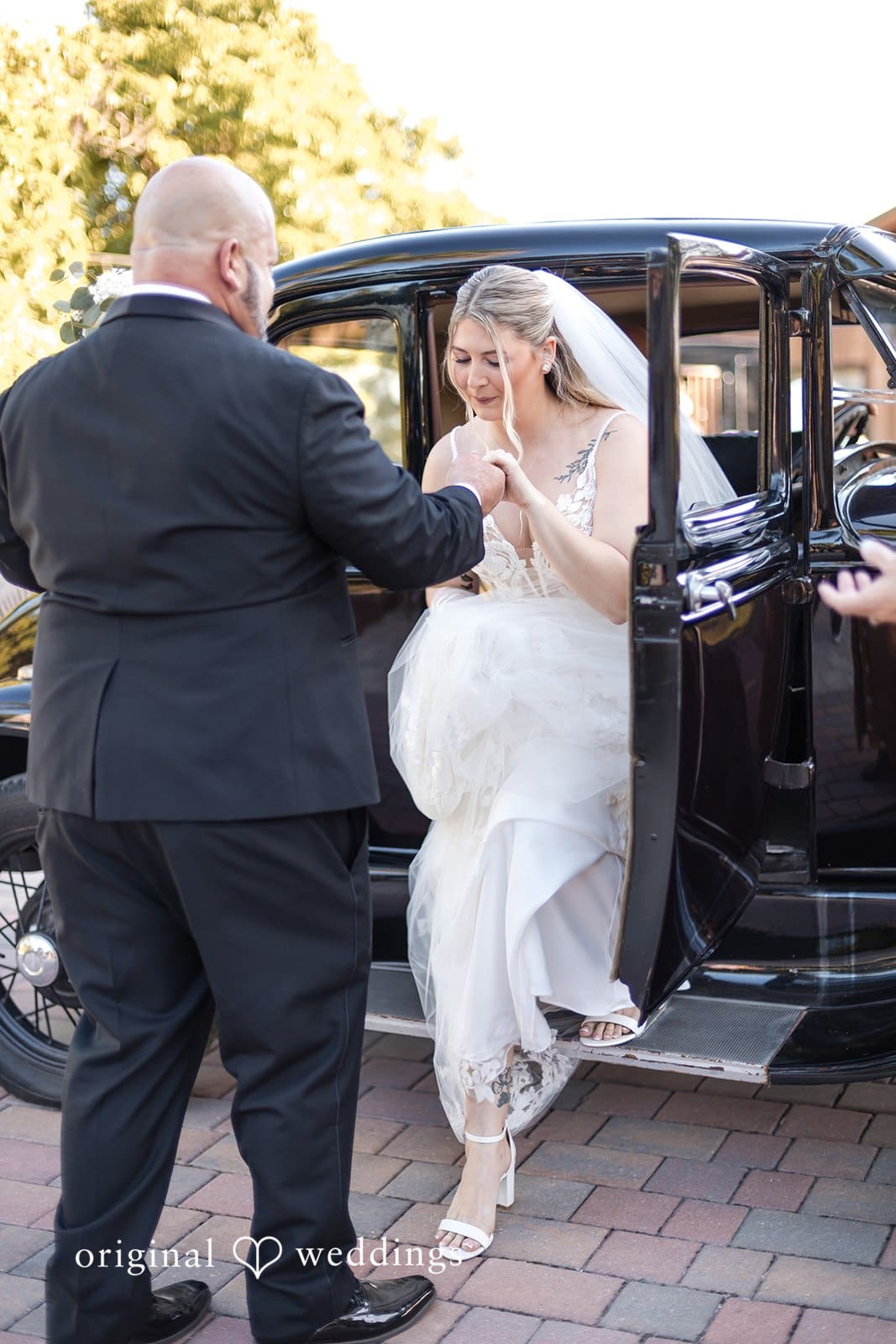 Man welcoming the bride with happy face.
