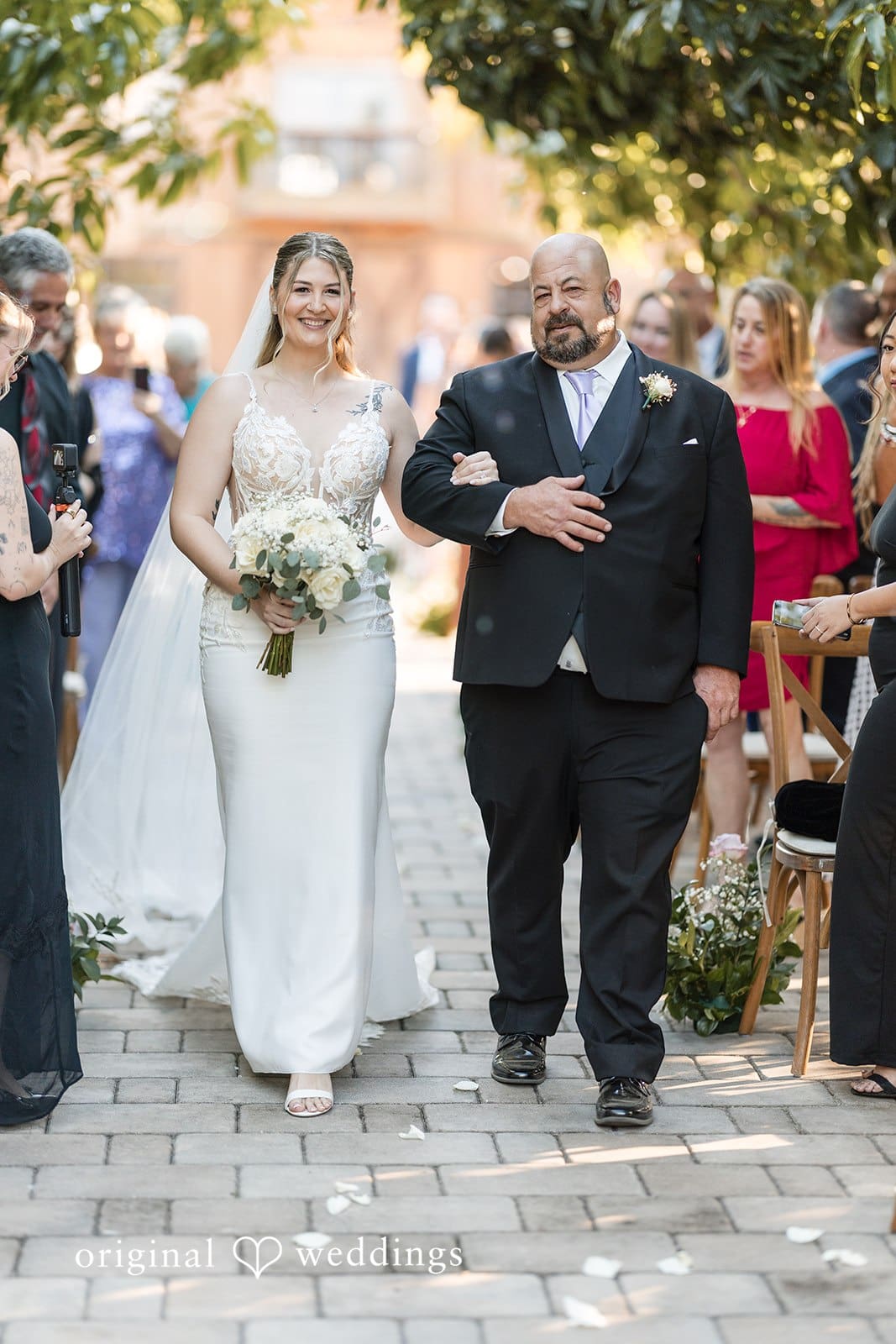Bride walking with dad