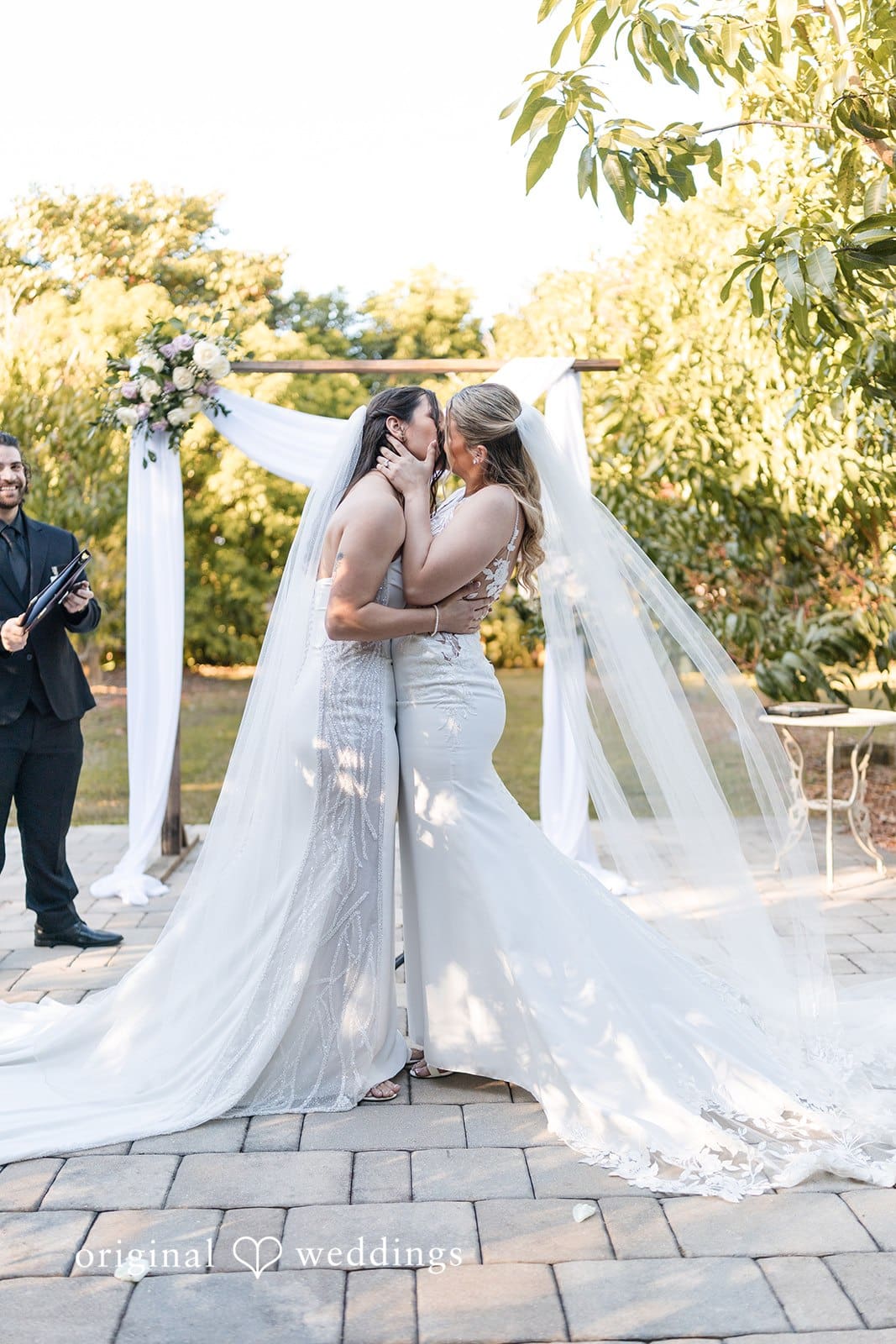Sharing a kiss at their wedding.
