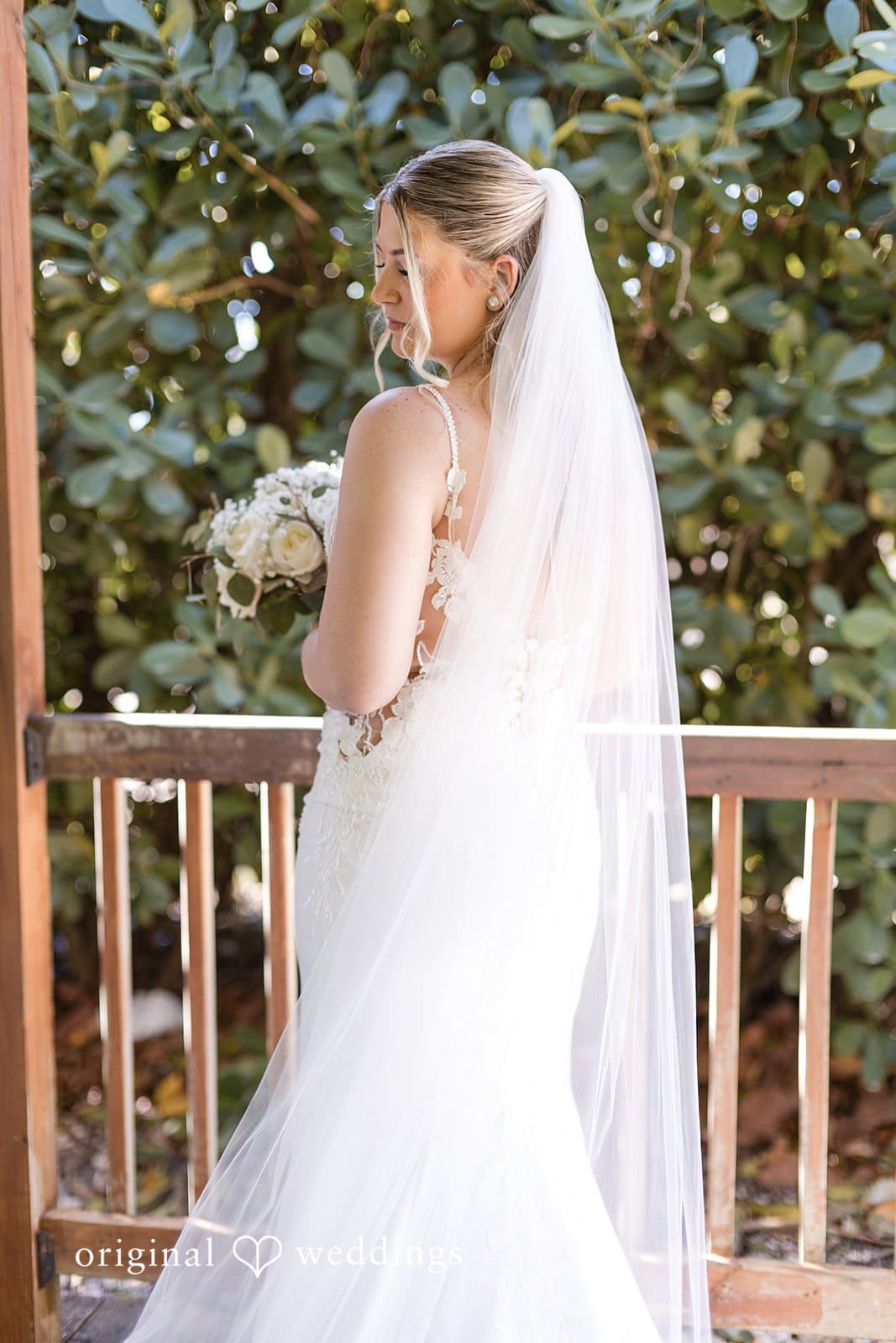 Bride radiant in white wedding dress.