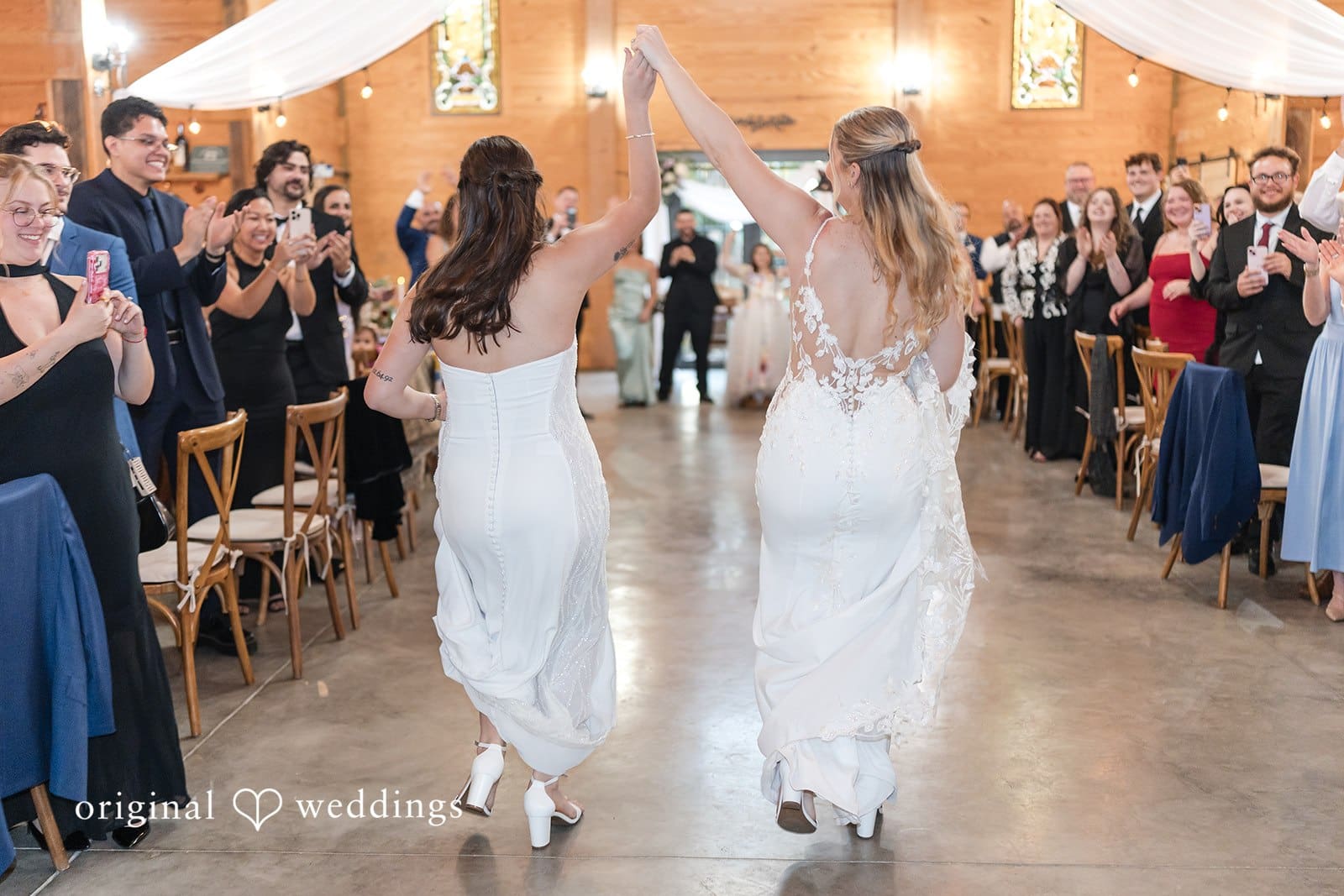 Brides walking down the aisle at a wedding ceremony.